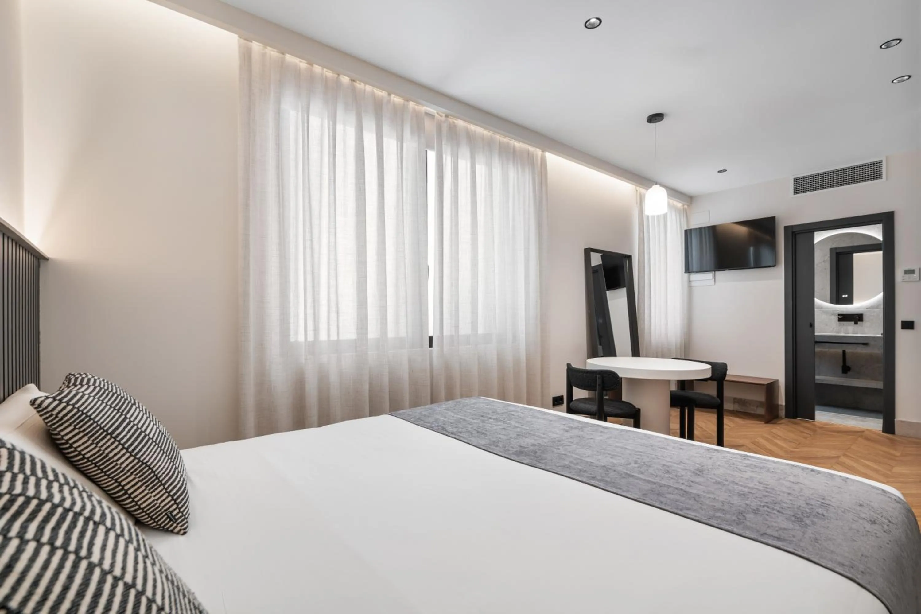 Bed in Pacifico Suites near Retiro