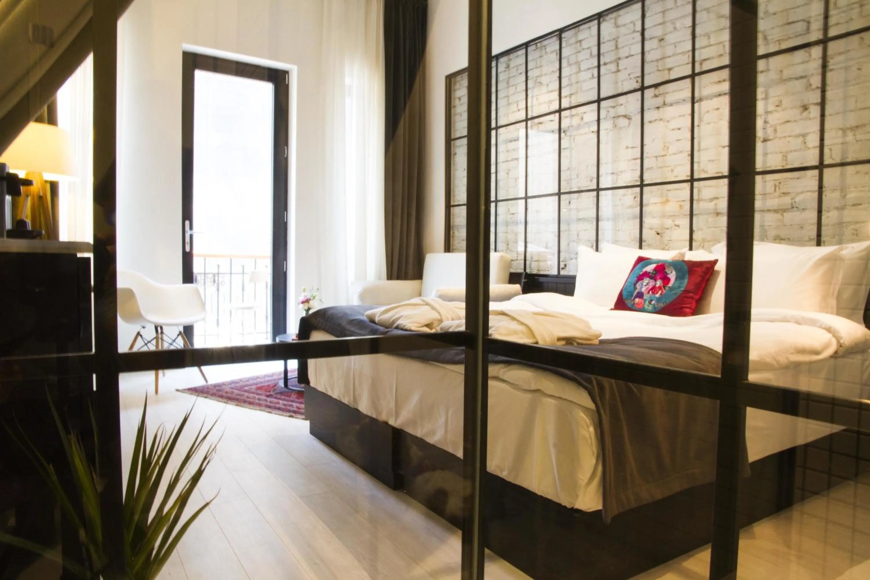 Photo of the whole room, Bed in Magnova Studios