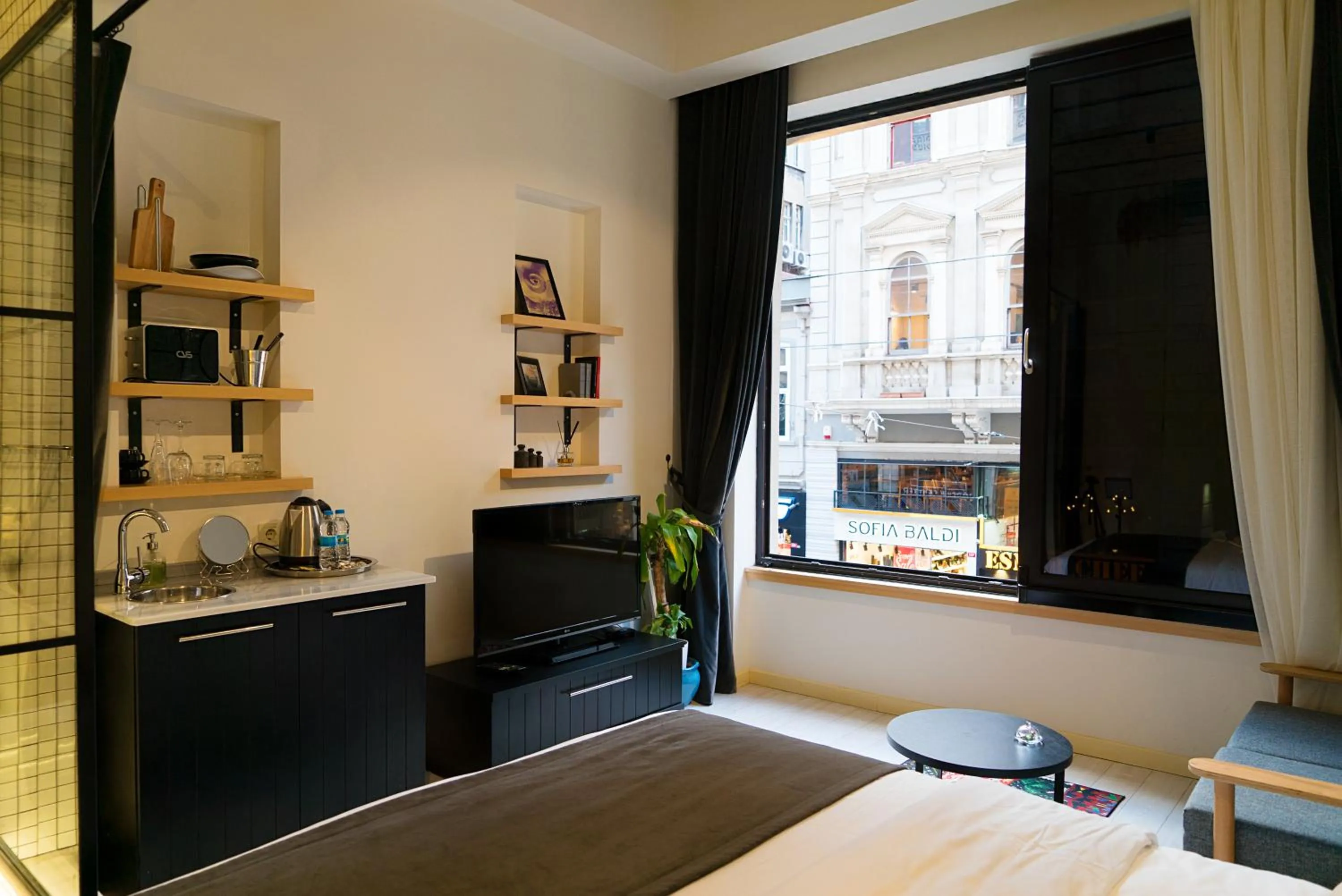 Photo of the whole room, Bed in Magnova Studios