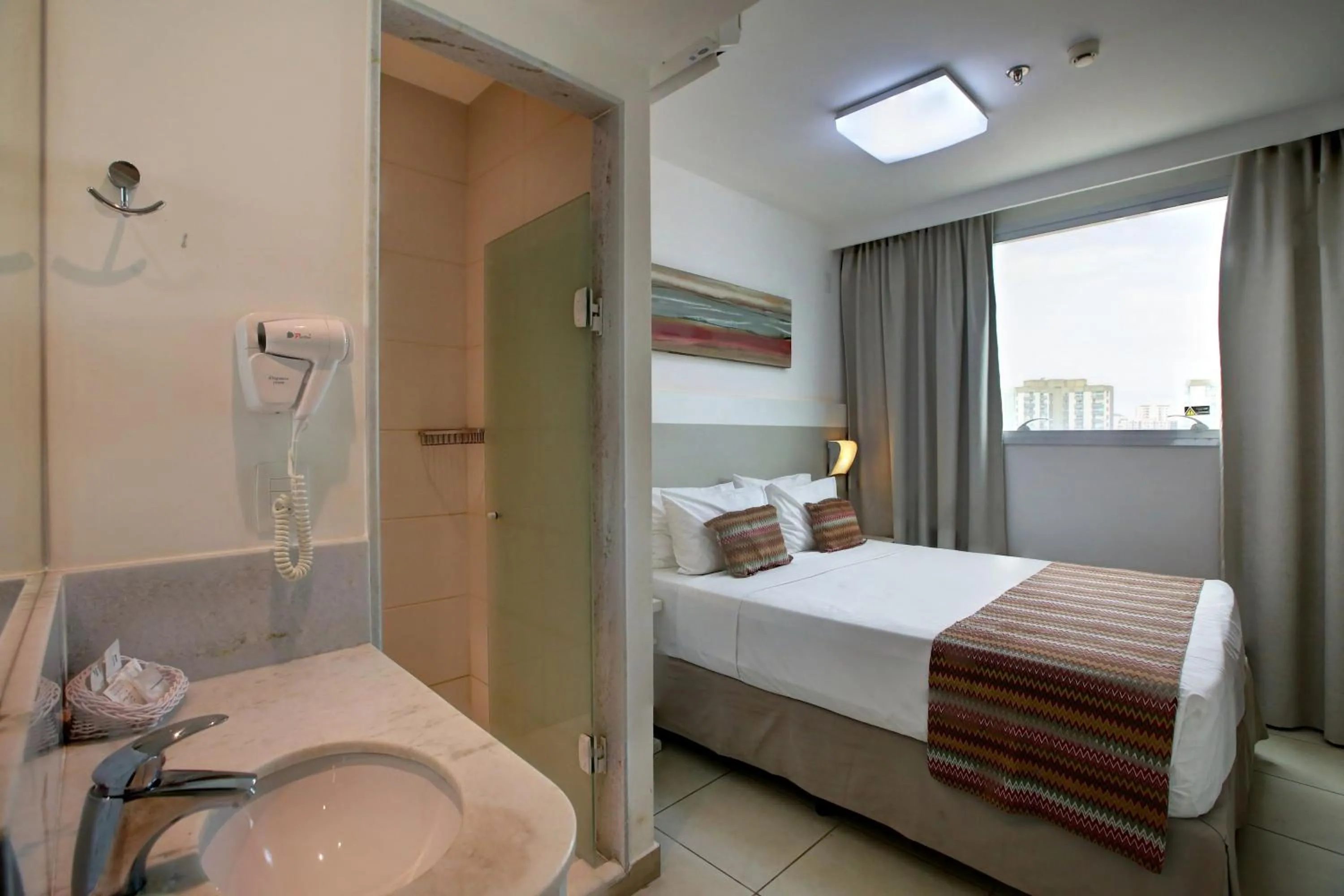 Photo of the whole room, Bed in Transamerica Fit Vitória Reta da Penha