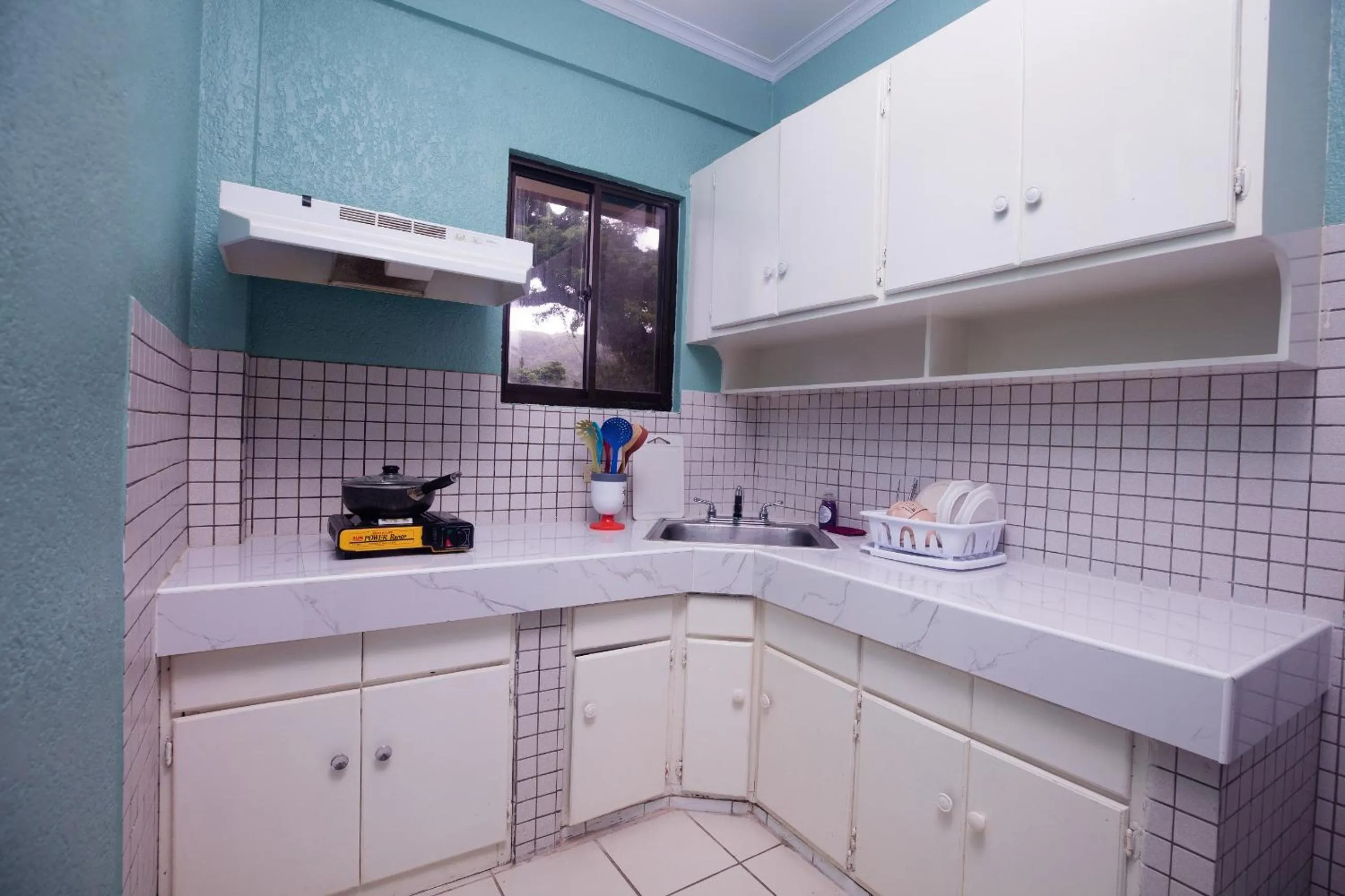 Kitchen or kitchenette in Beach Garden Hotel