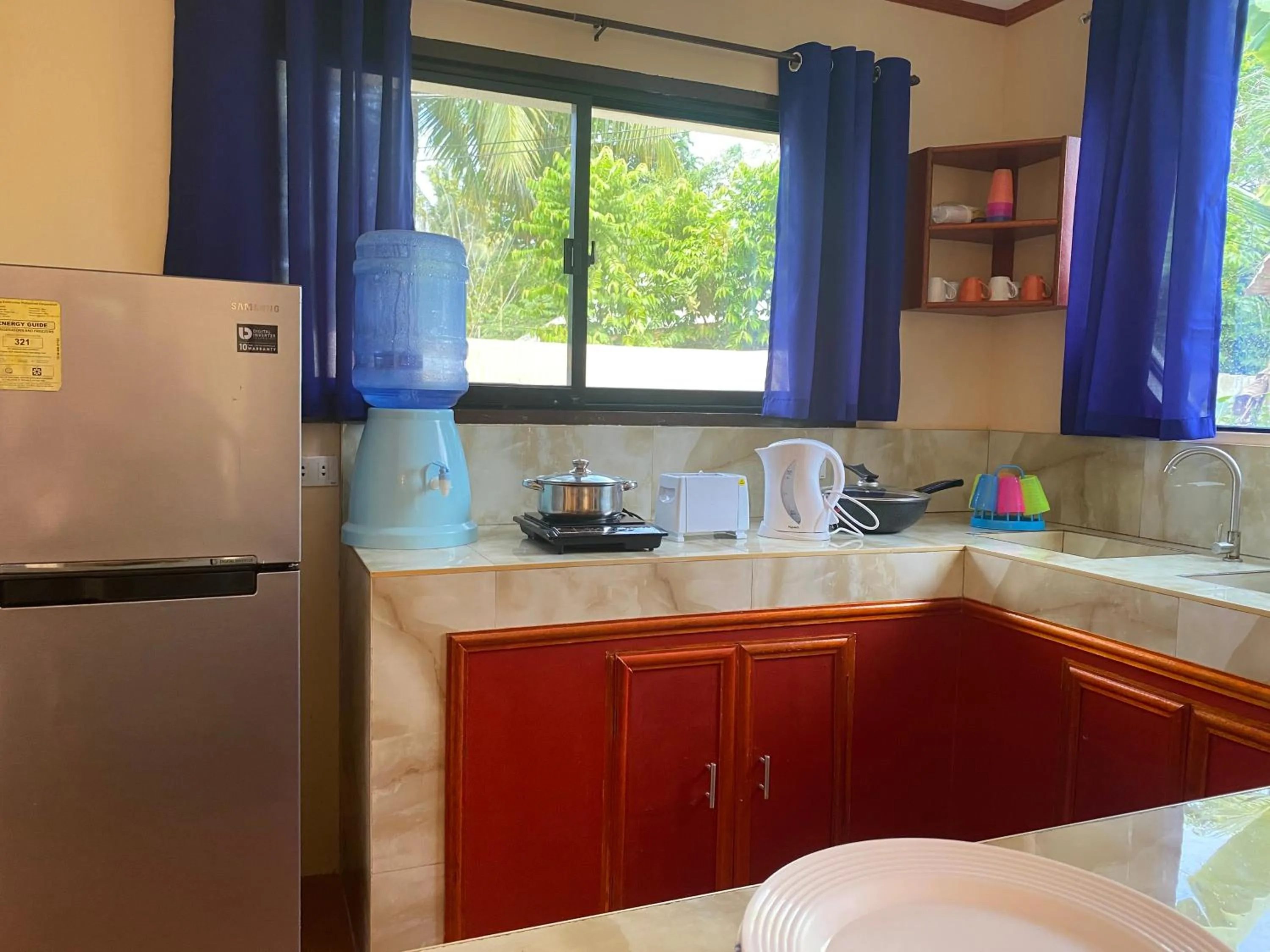 Kitchen or kitchenette in Siargao Sunset Bay Beach Villas