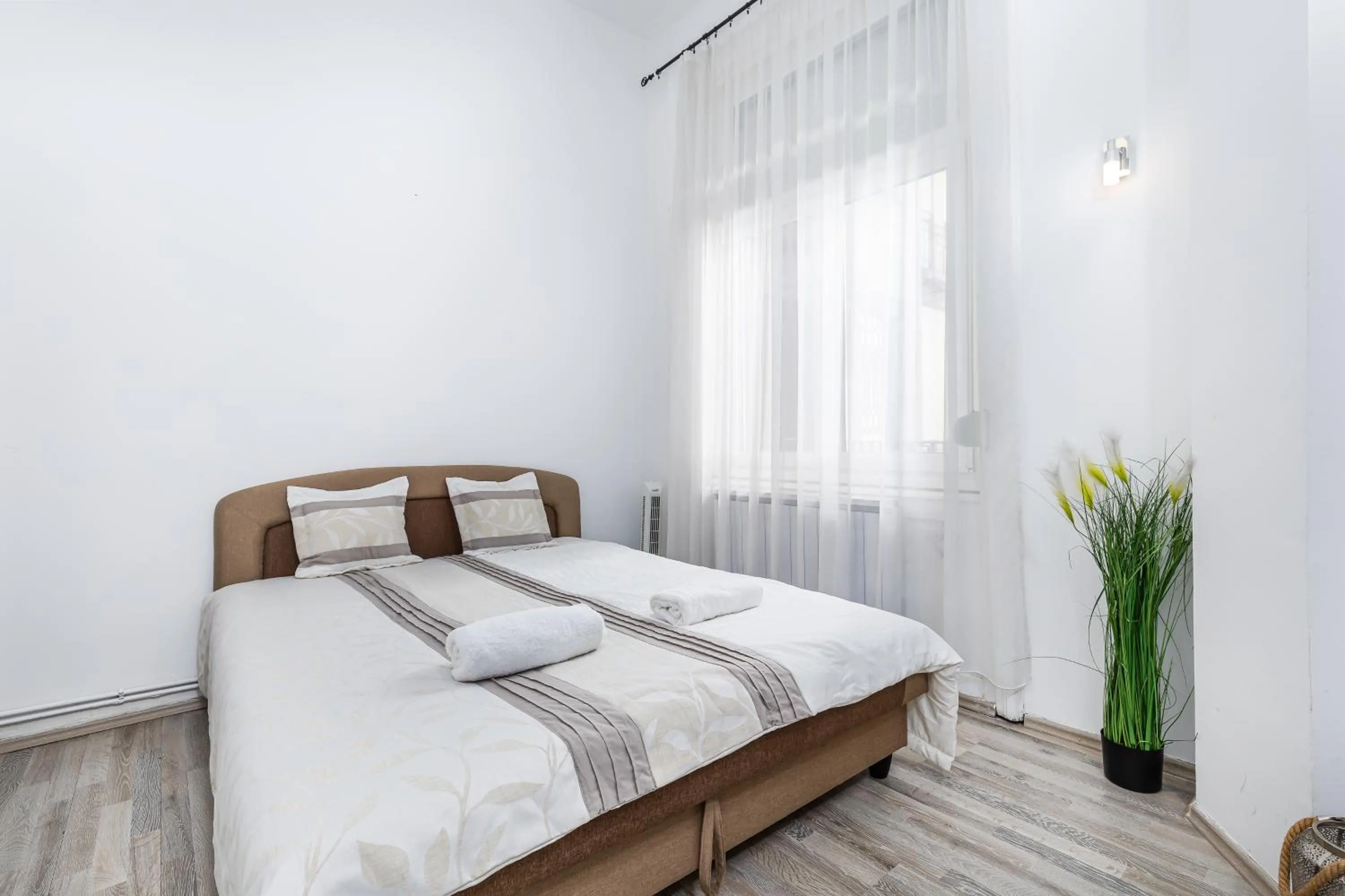 Bed in Real Apartments Lovag