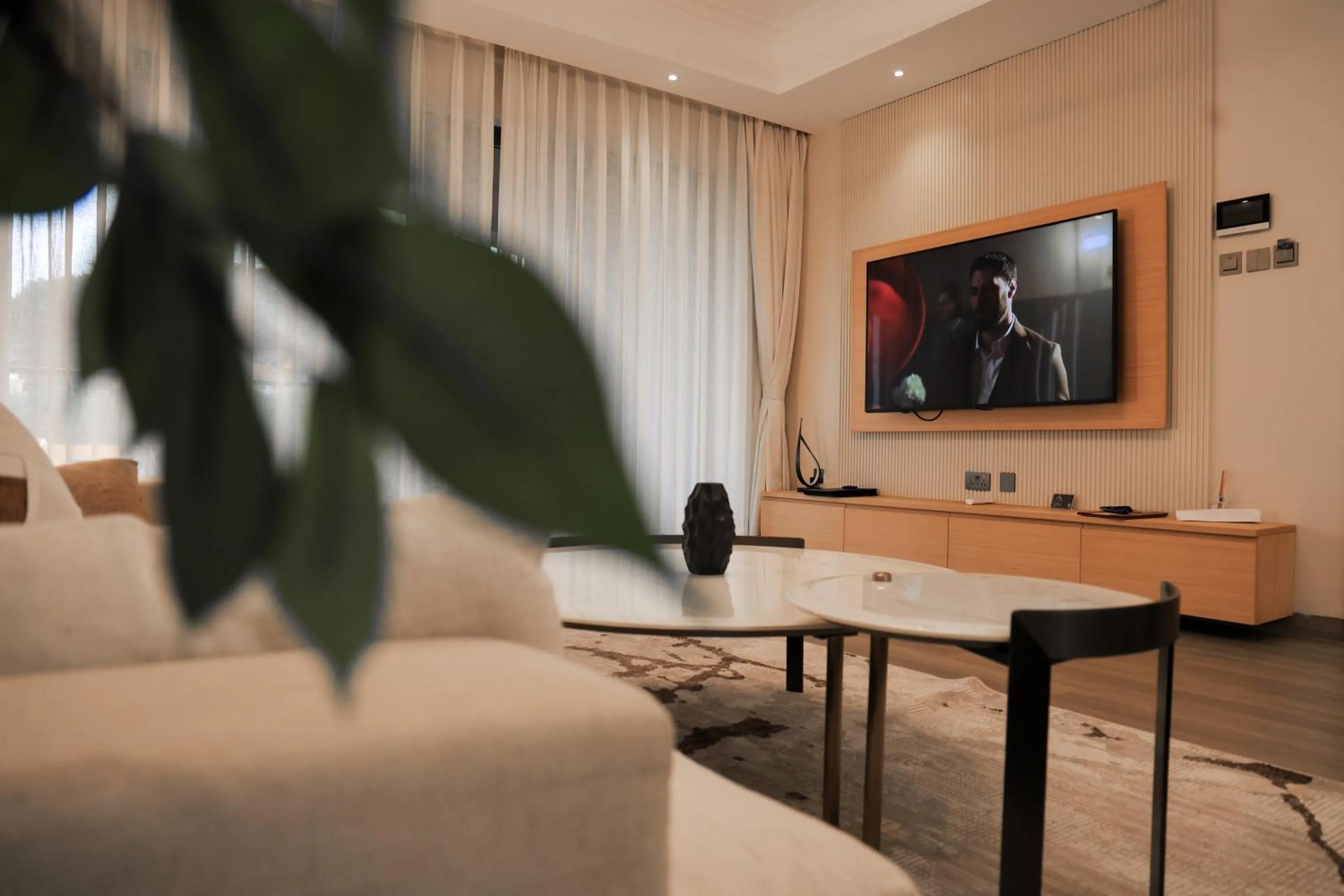 Communal lounge/ TV room in Abrish Hotel and Apartment