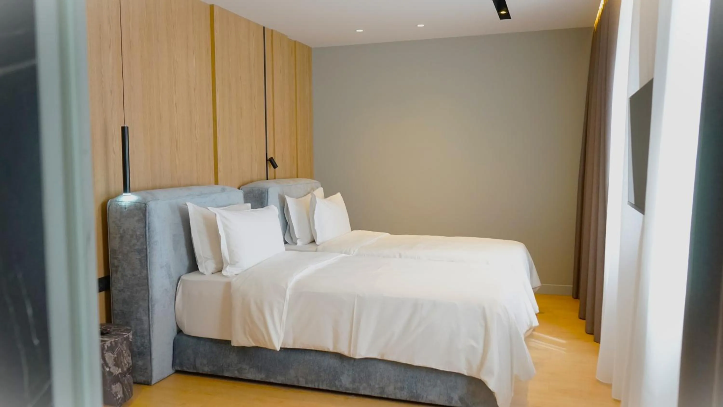 Bed in Arbnor Boutique Hotel