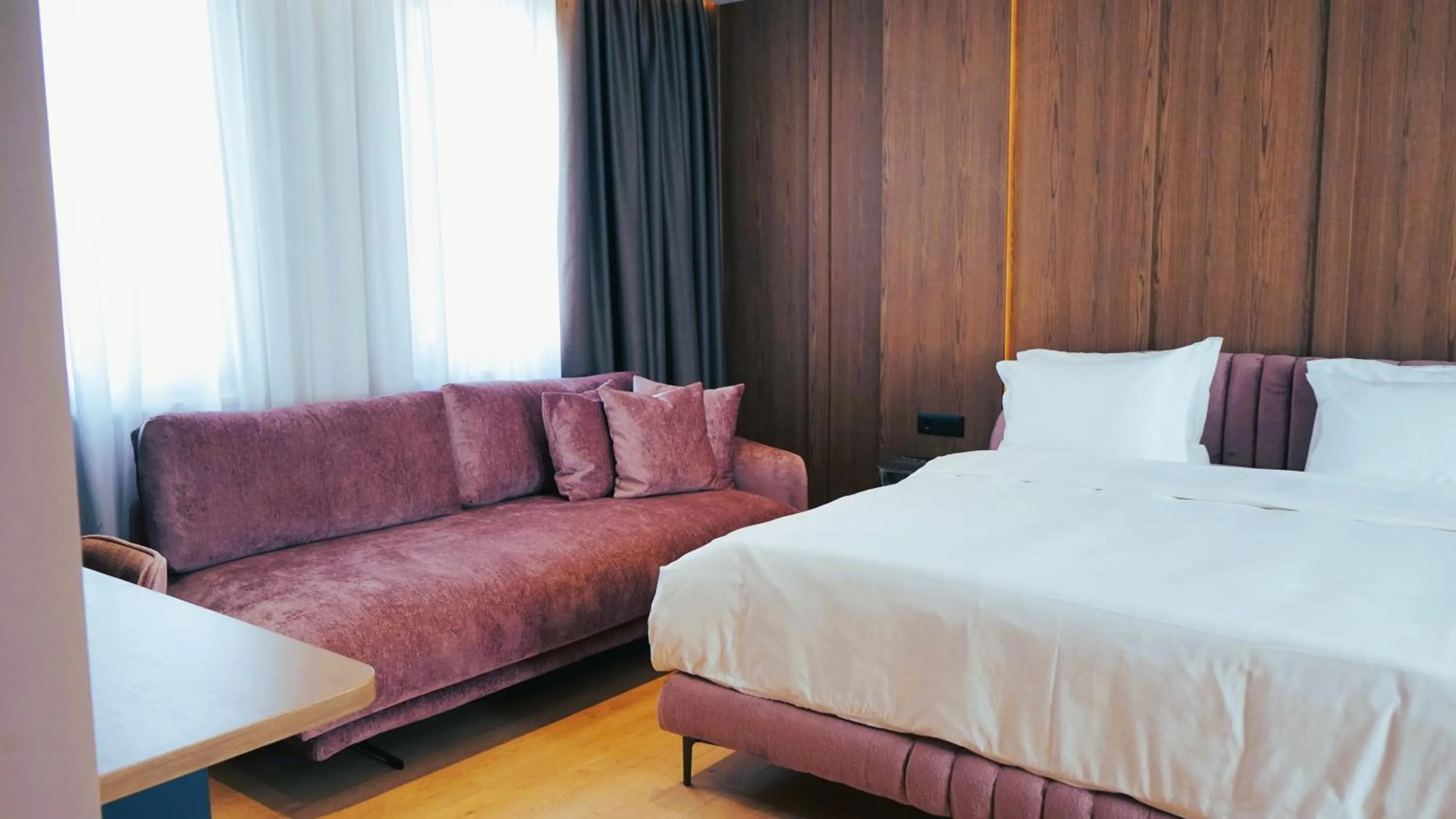 Seating area, Bed in Arbnor Boutique Hotel