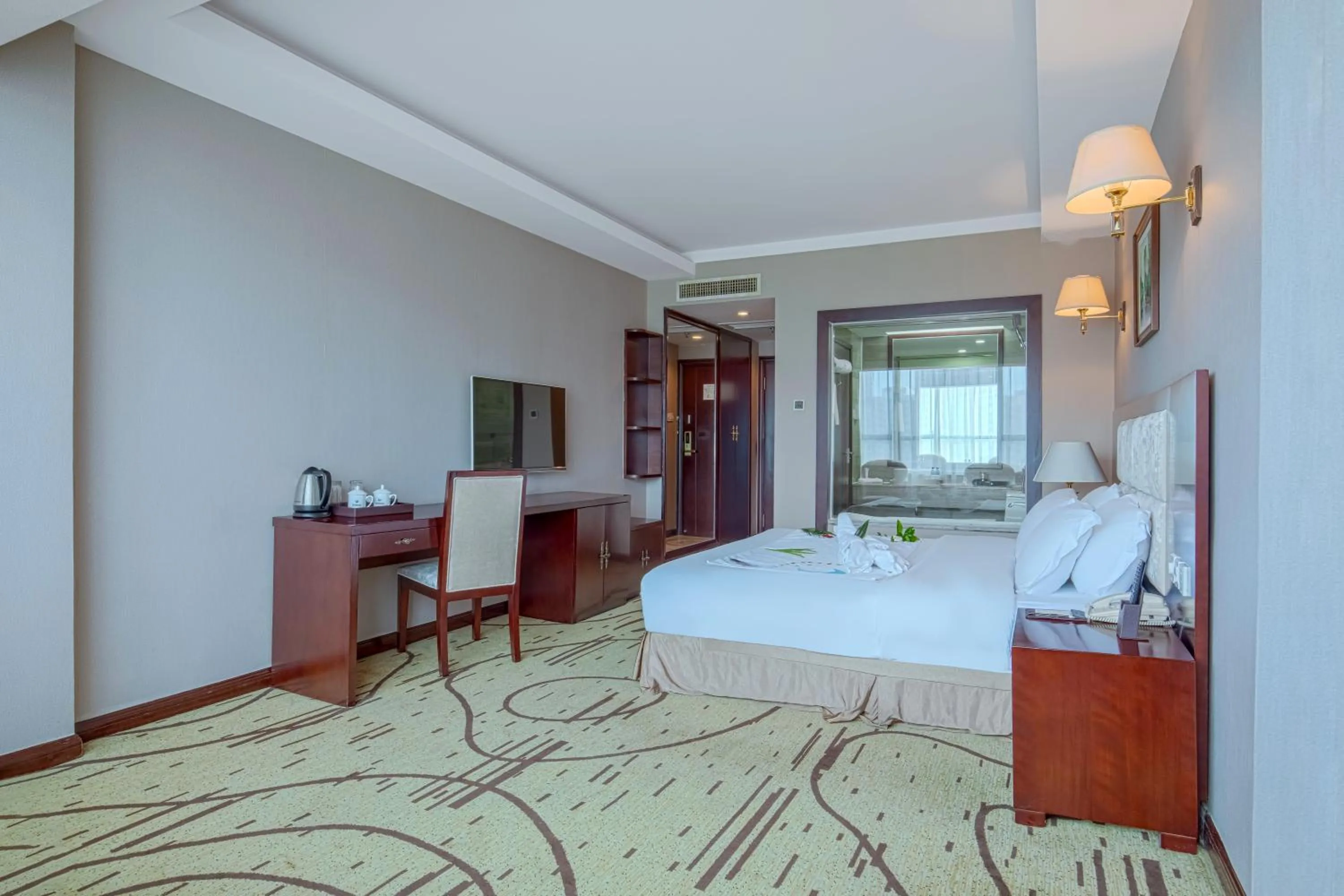 Communal lounge/ TV room, Bed in Zhangjiajie International Hotel