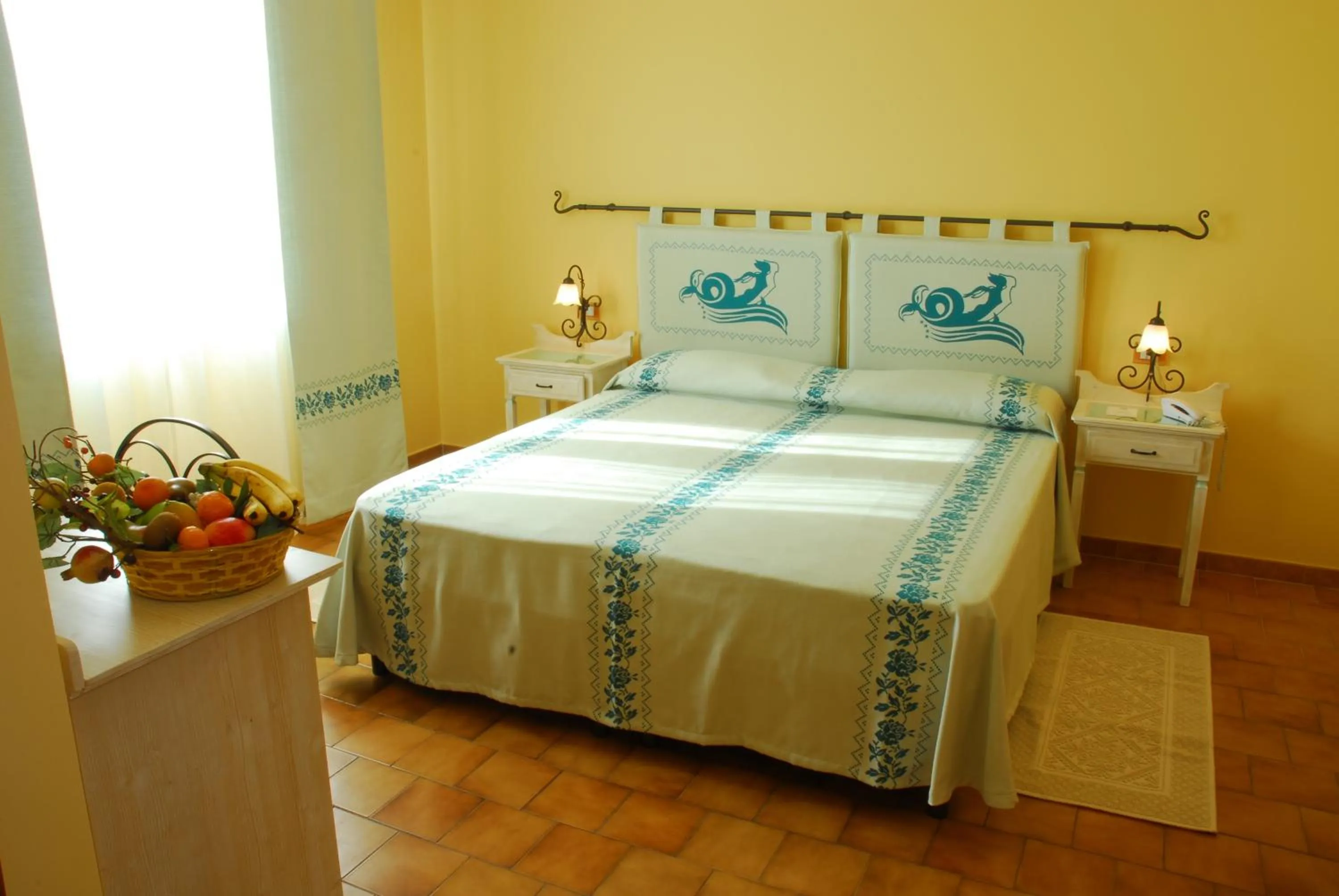Bed in Le Nereidi Hotel & Residence