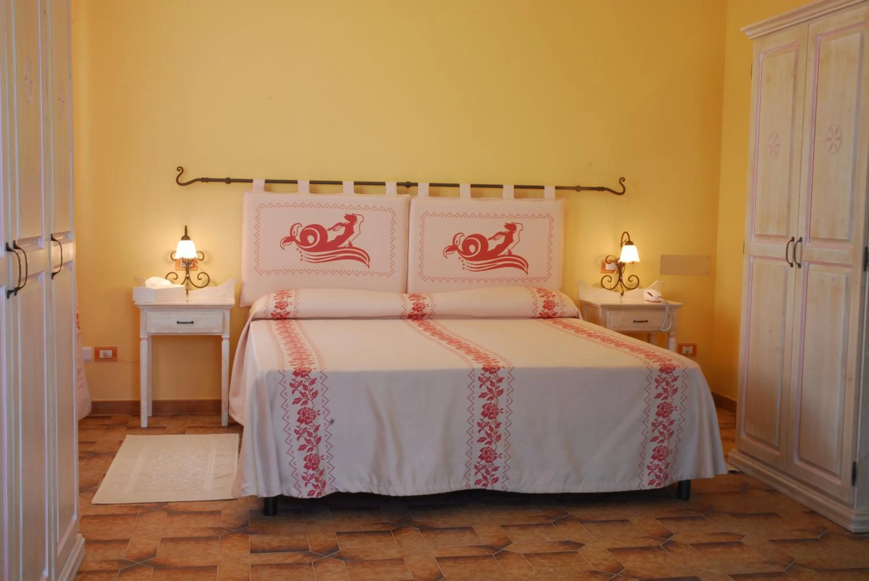 Bed in Le Nereidi Hotel & Residence