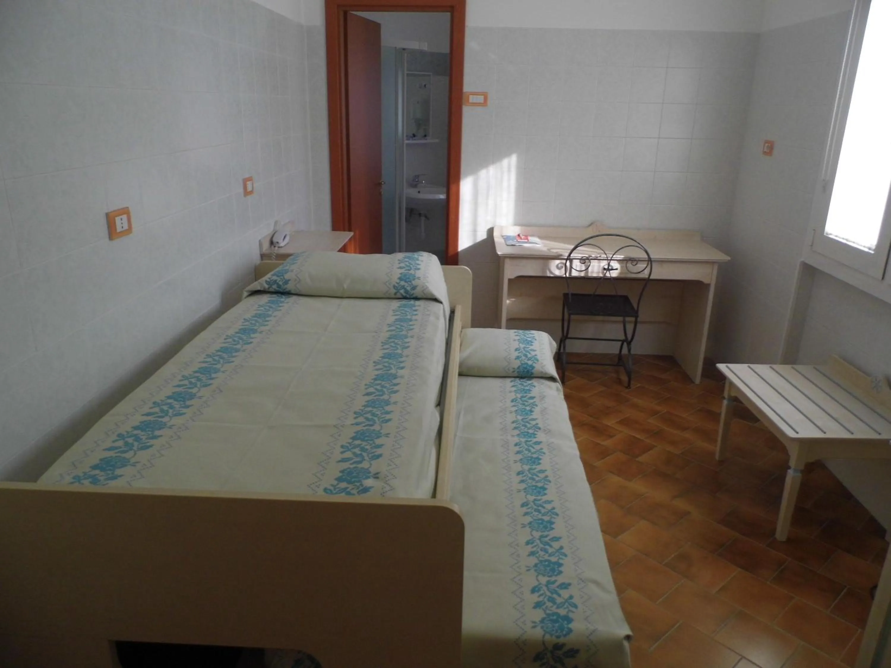 Bed in Le Nereidi Hotel & Residence