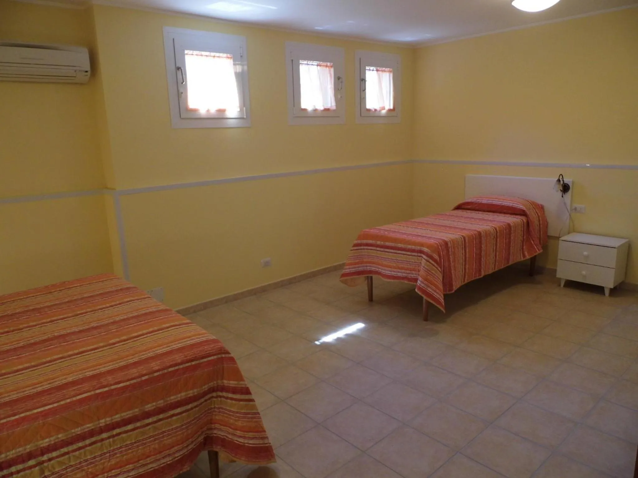 Bed in Le Nereidi Hotel & Residence