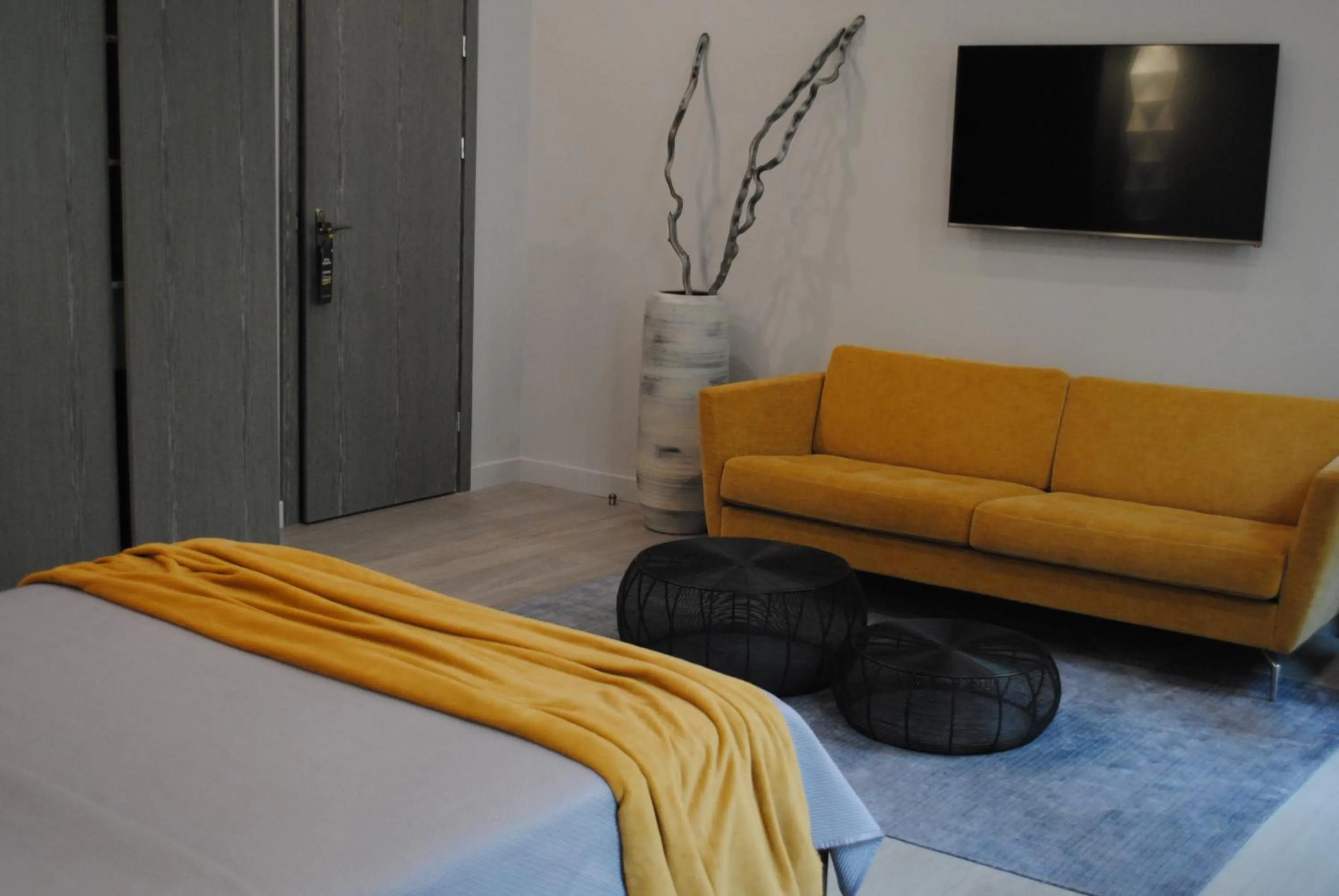 Seating area, Bed in Les Suites Massena