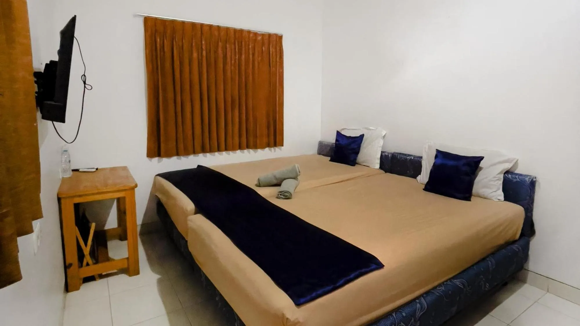 Bed in NamRoom at Tomang