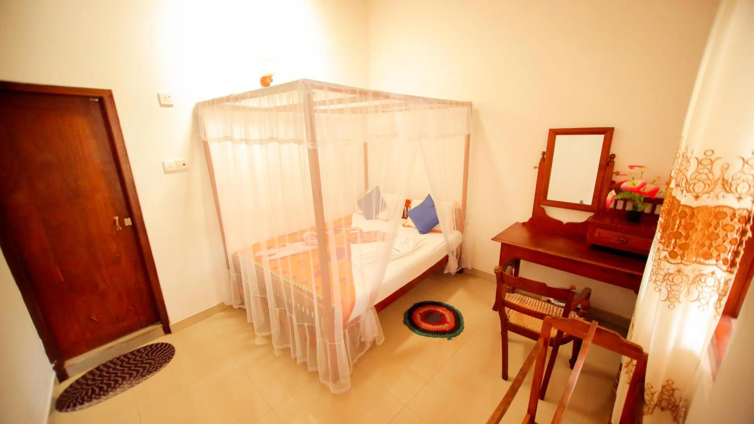 Bedroom in The Frangipani motel