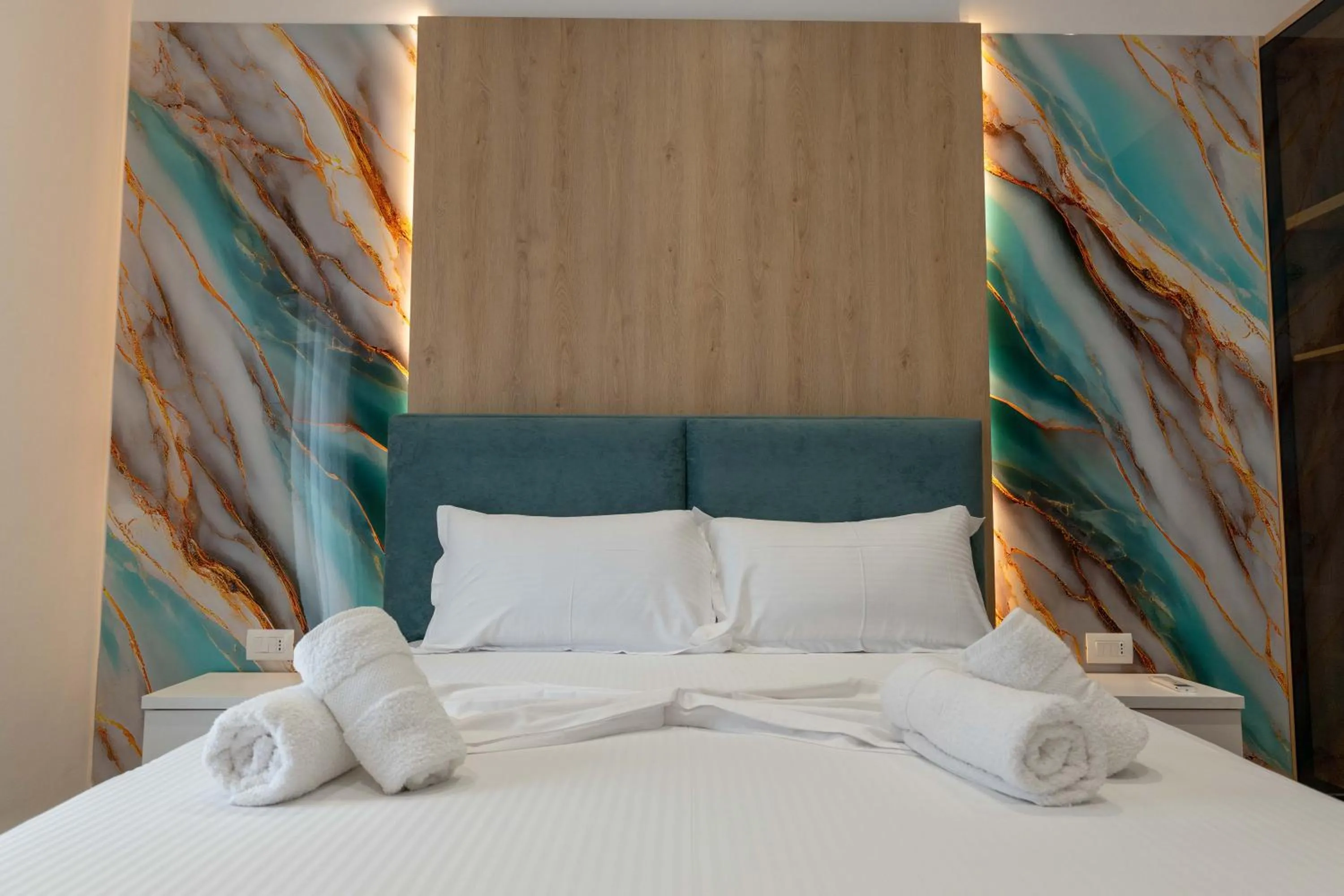 Bed in Regal Luxury Apartments