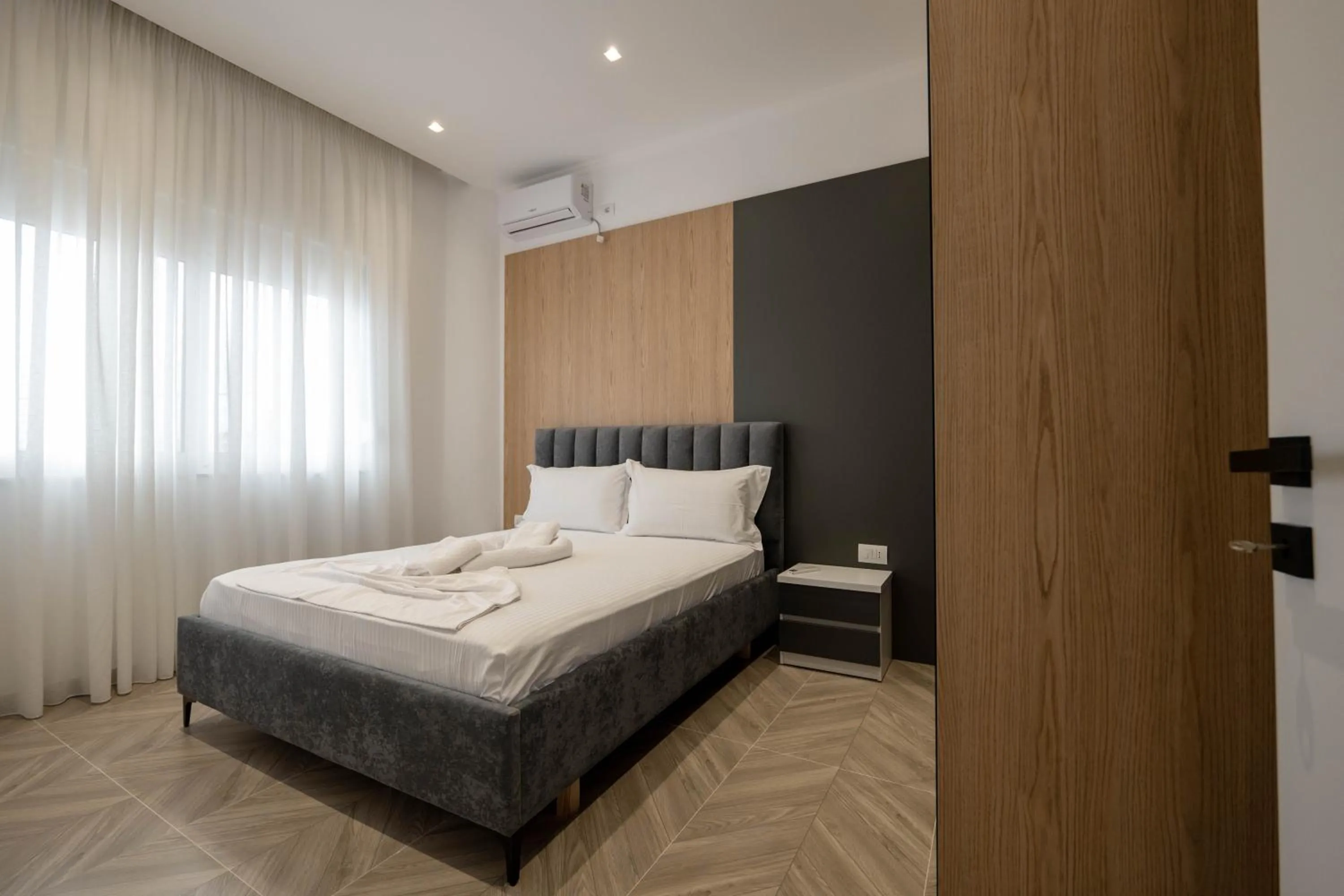 Bed in Regal Luxury Apartments