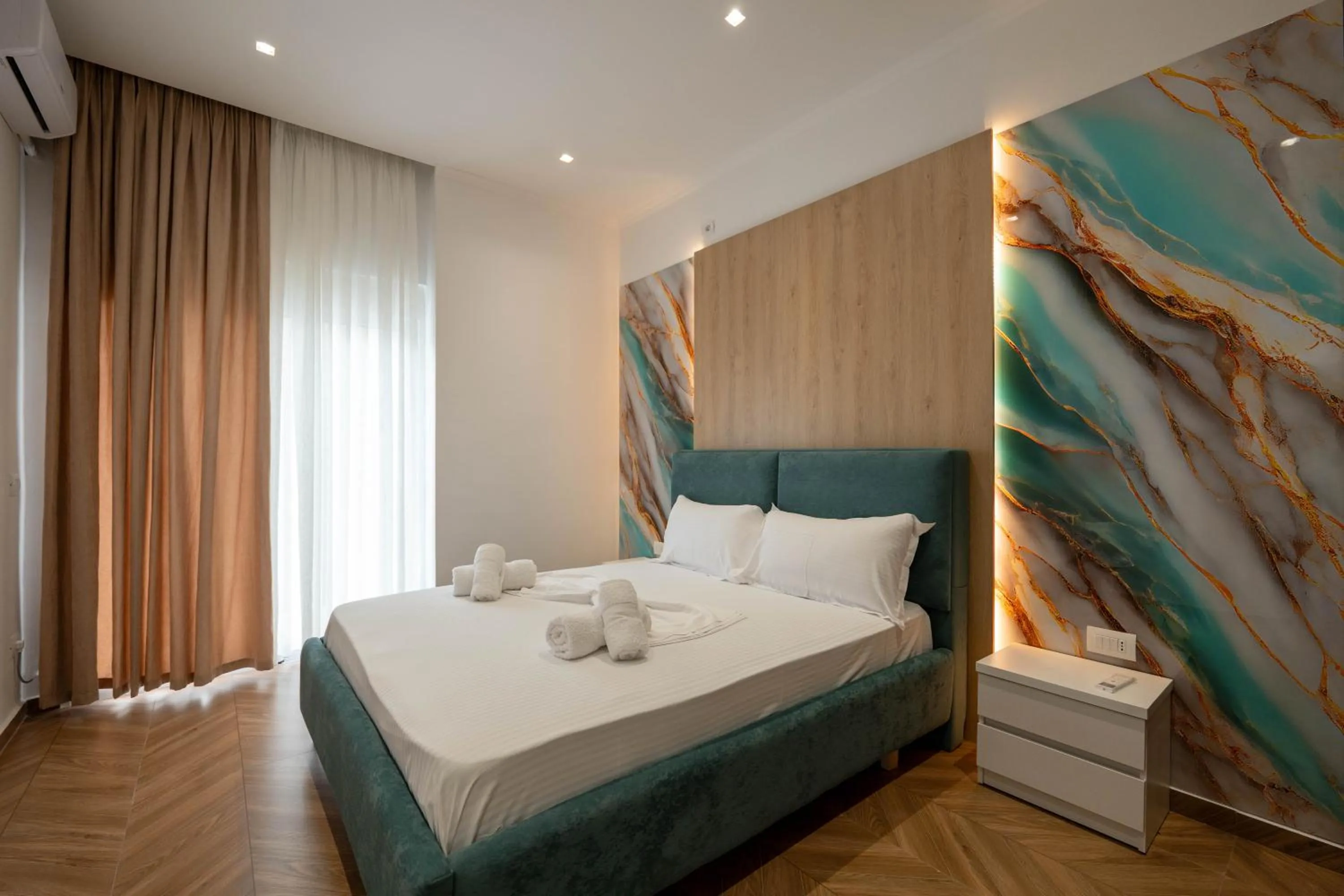 Bed in Regal Luxury Apartments