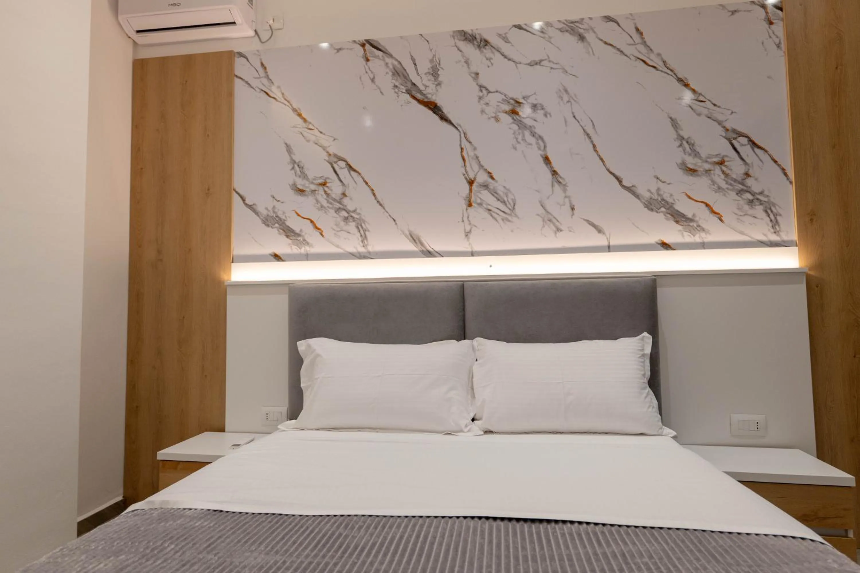 Bed in Regal Luxury Apartments