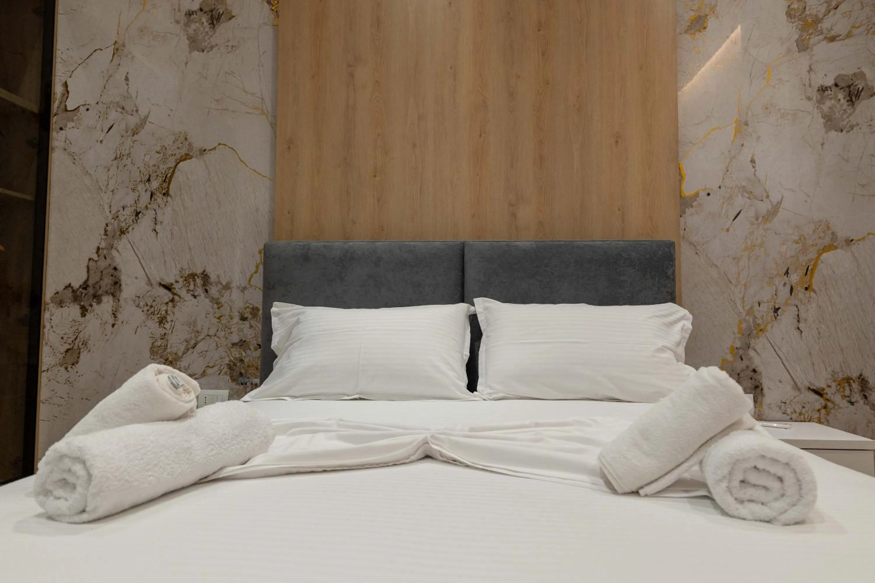 Bed in Regal Luxury Apartments