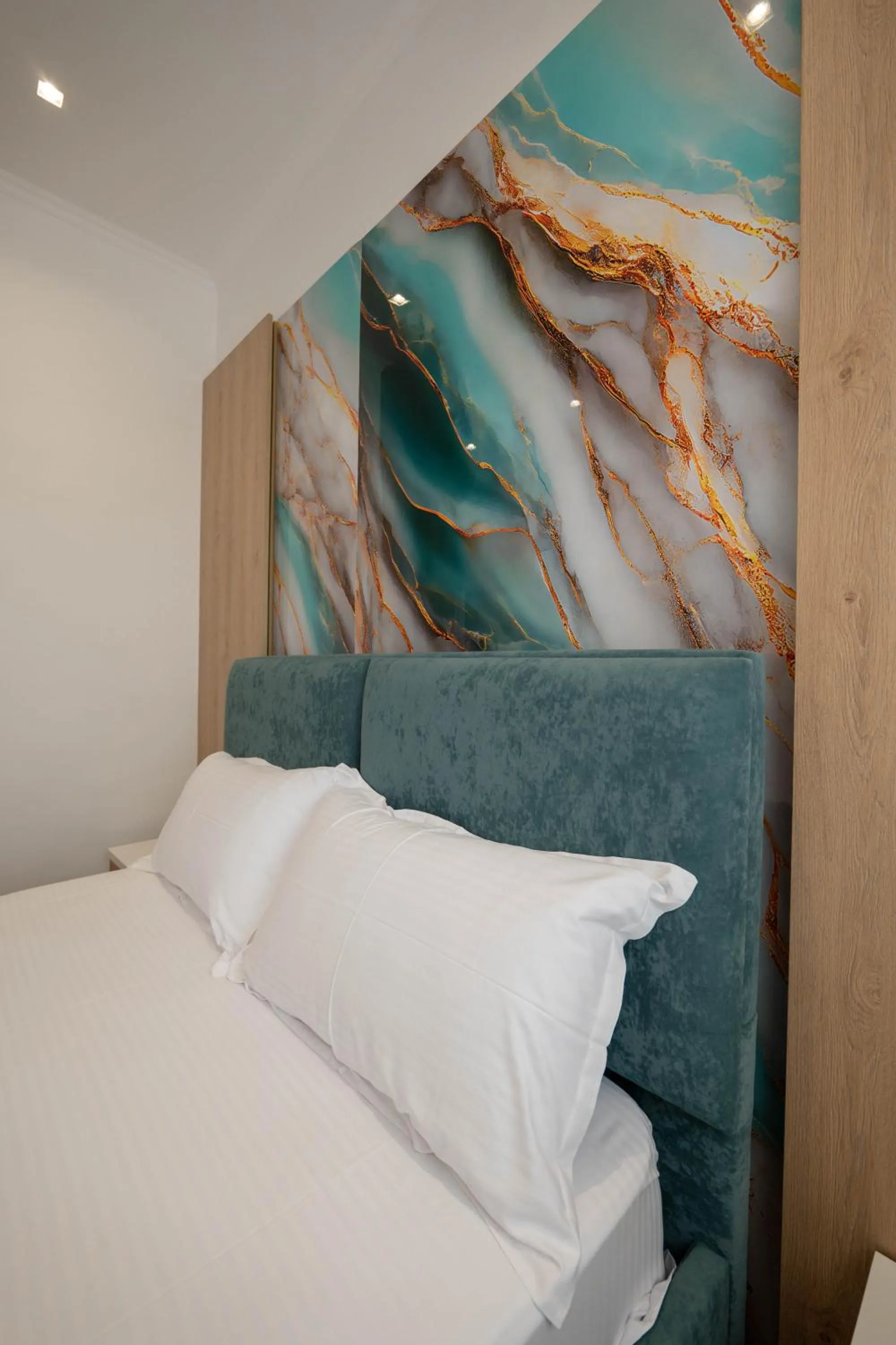 Bed in Regal Luxury Apartments