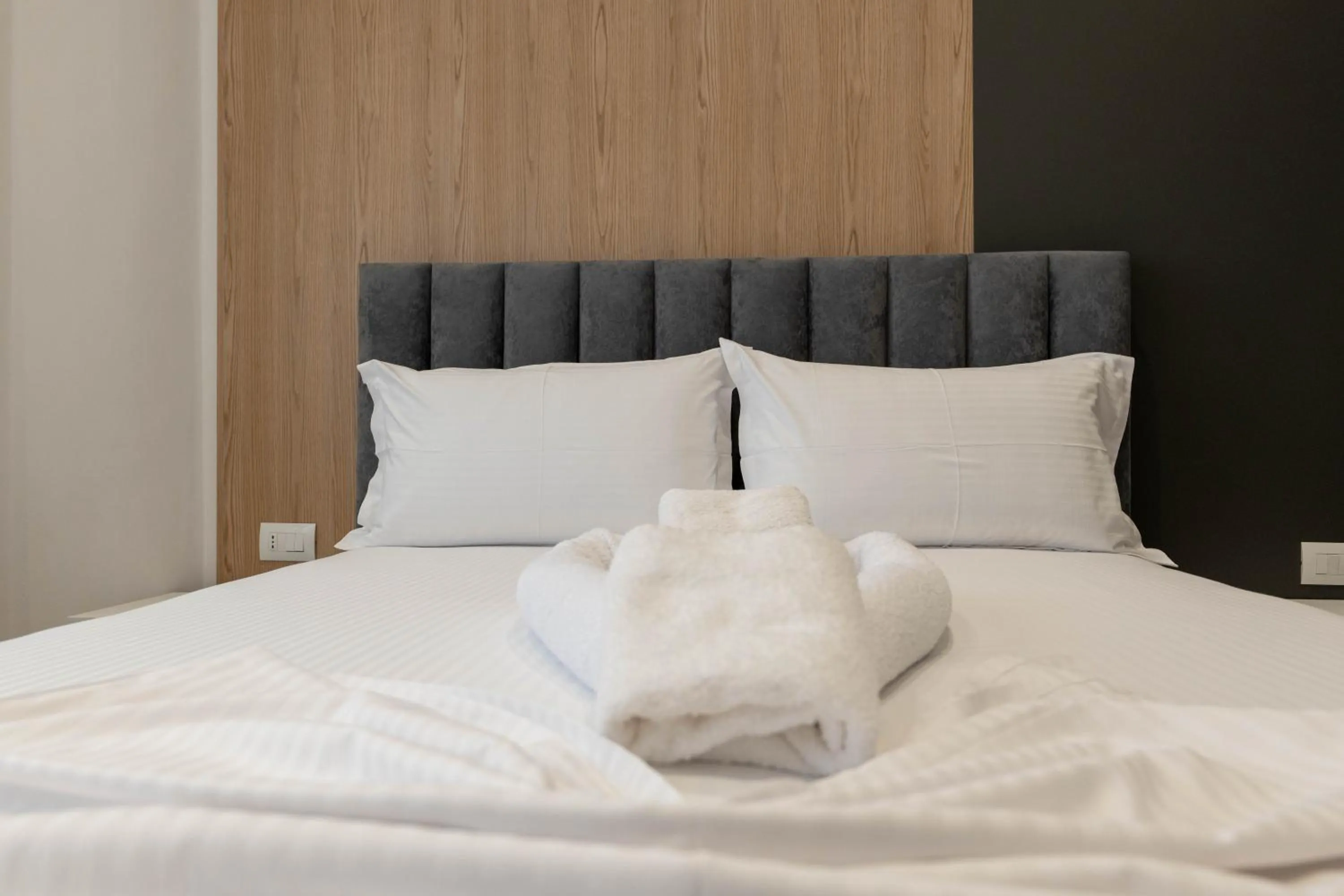 Bed in Regal Luxury Apartments