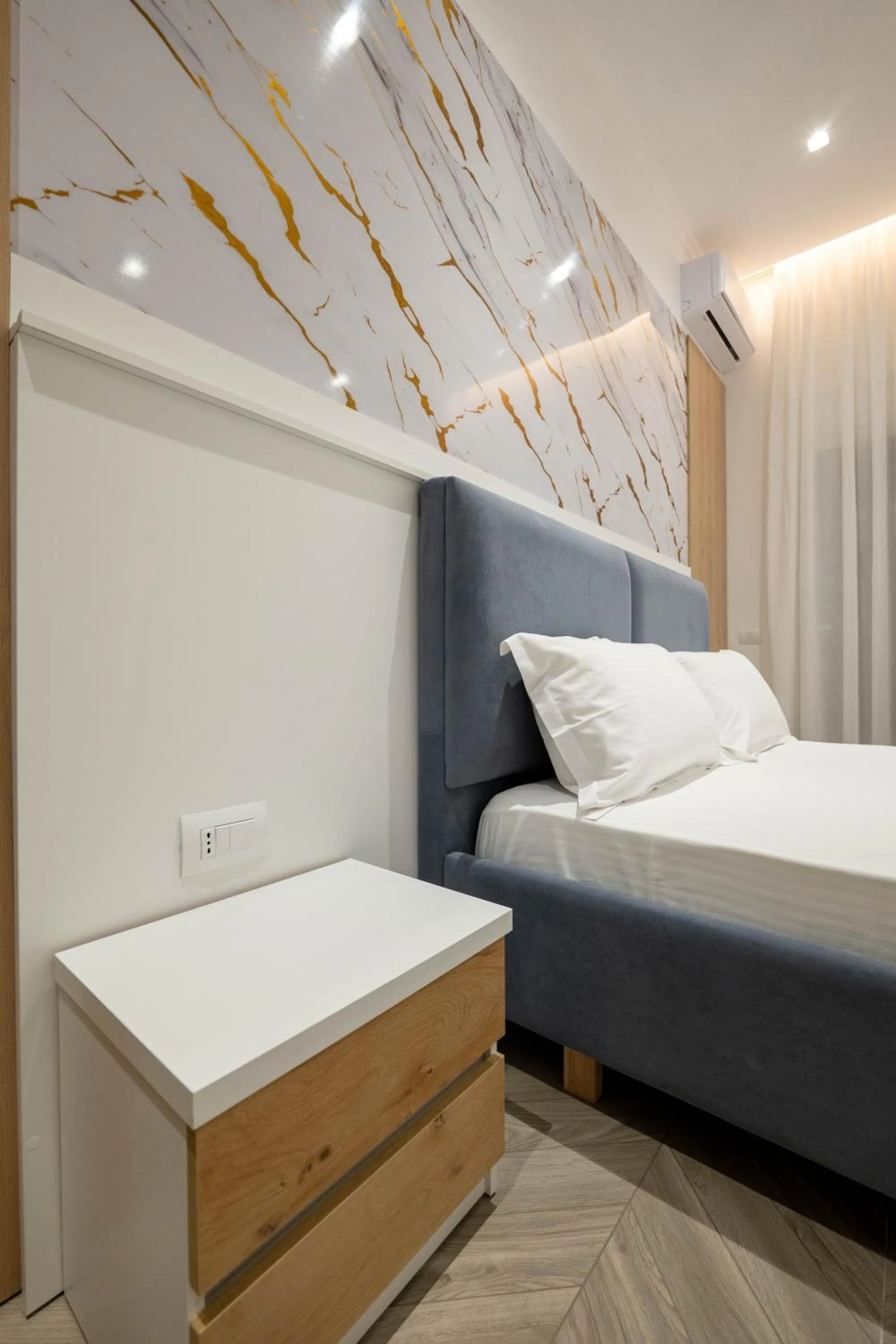 Bed in Regal Luxury Apartments