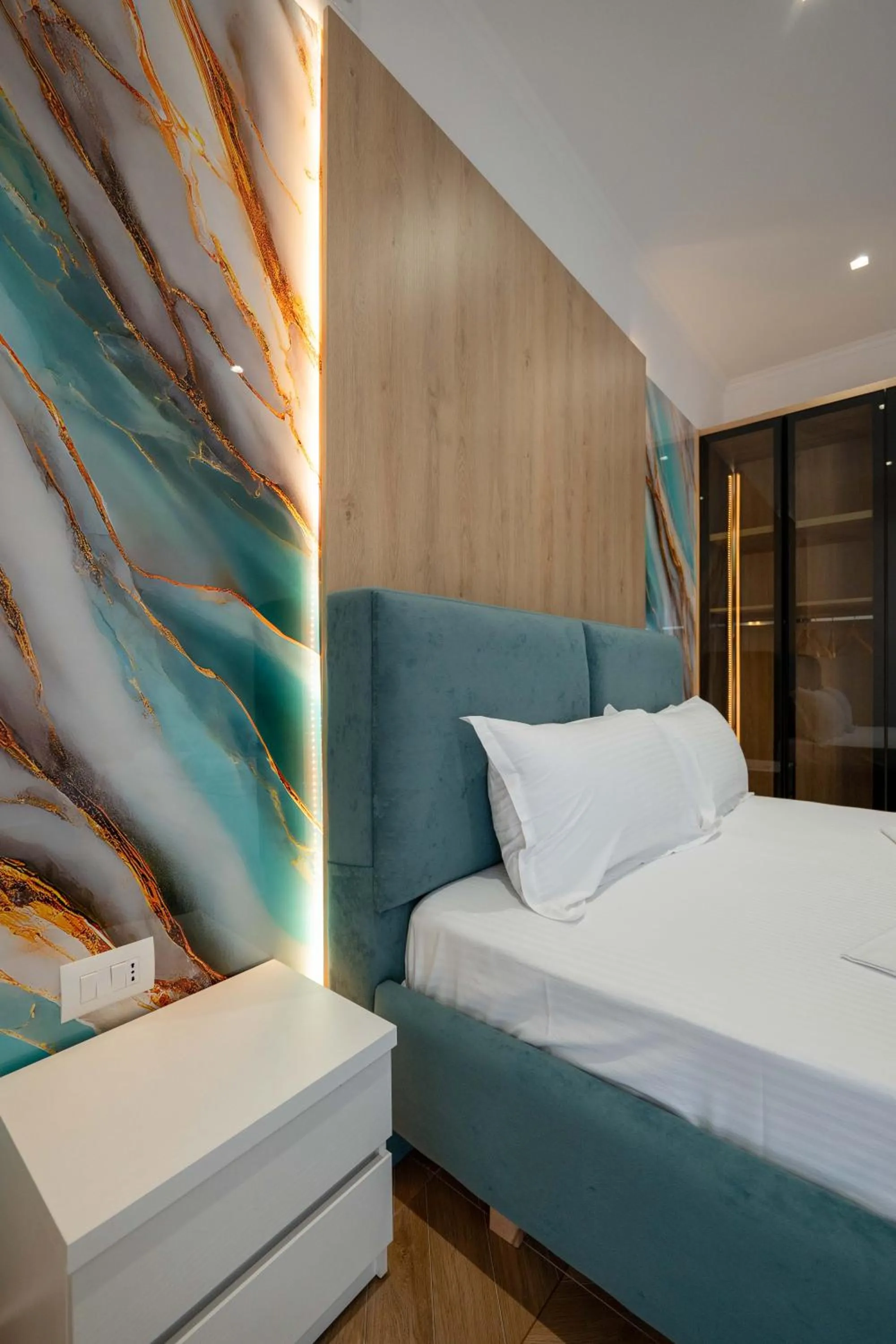 Bed in Regal Luxury Apartments