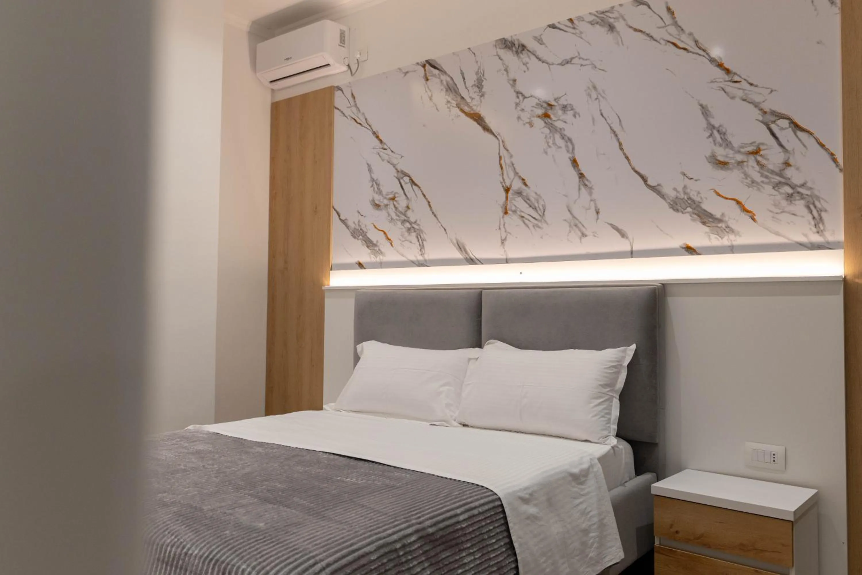 Bed in Regal Luxury Apartments