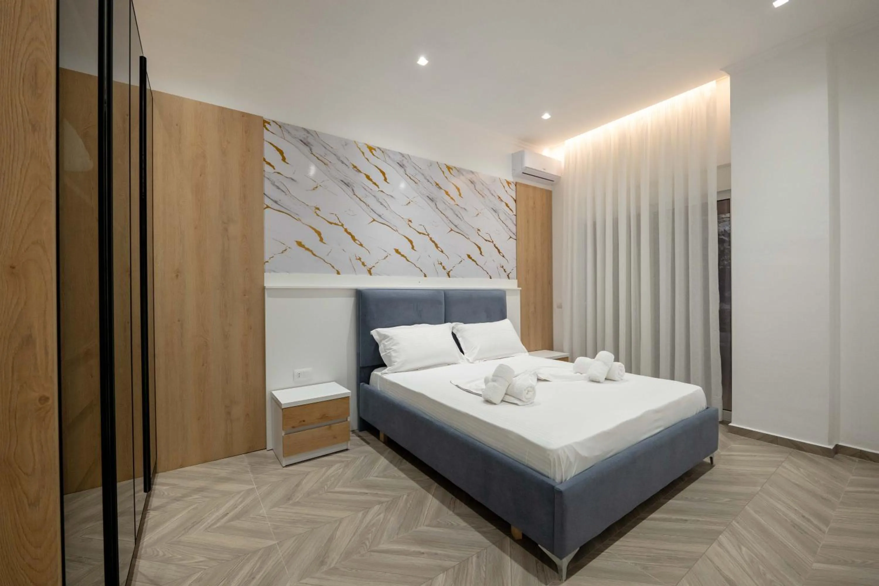 Bed in Regal Luxury Apartments