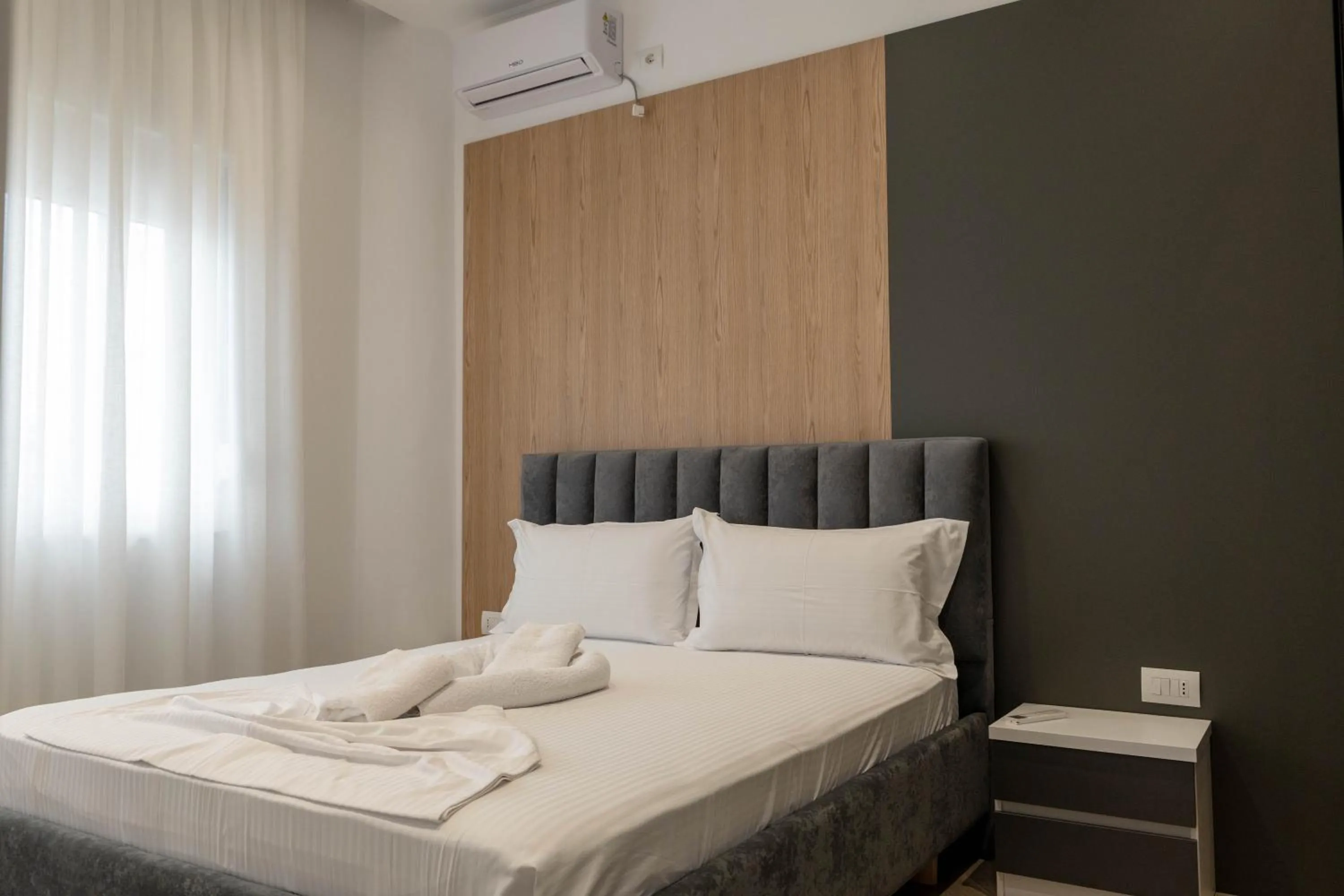 Bed in Regal Luxury Apartments