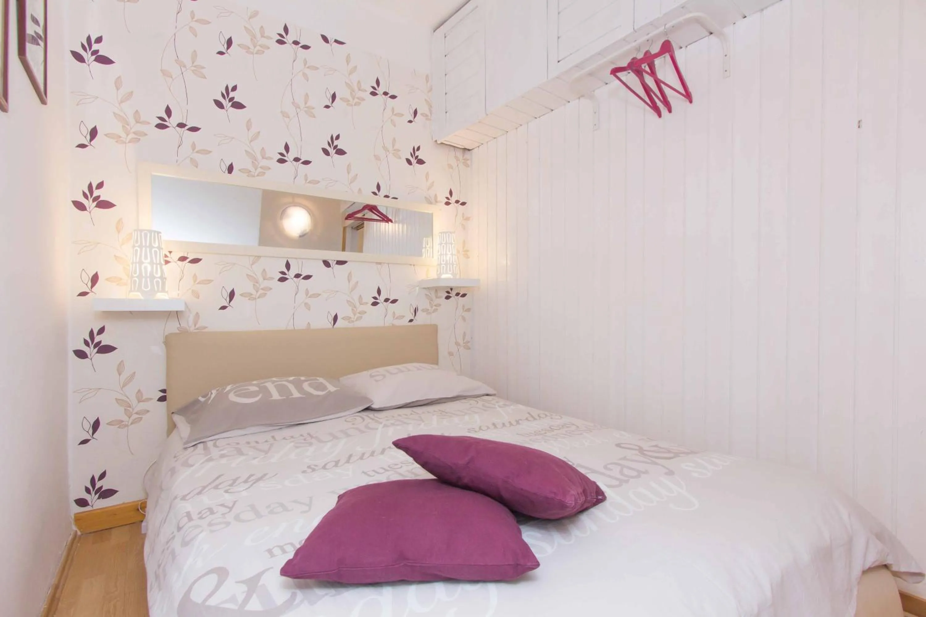 Bed in Red Valentino Apartment