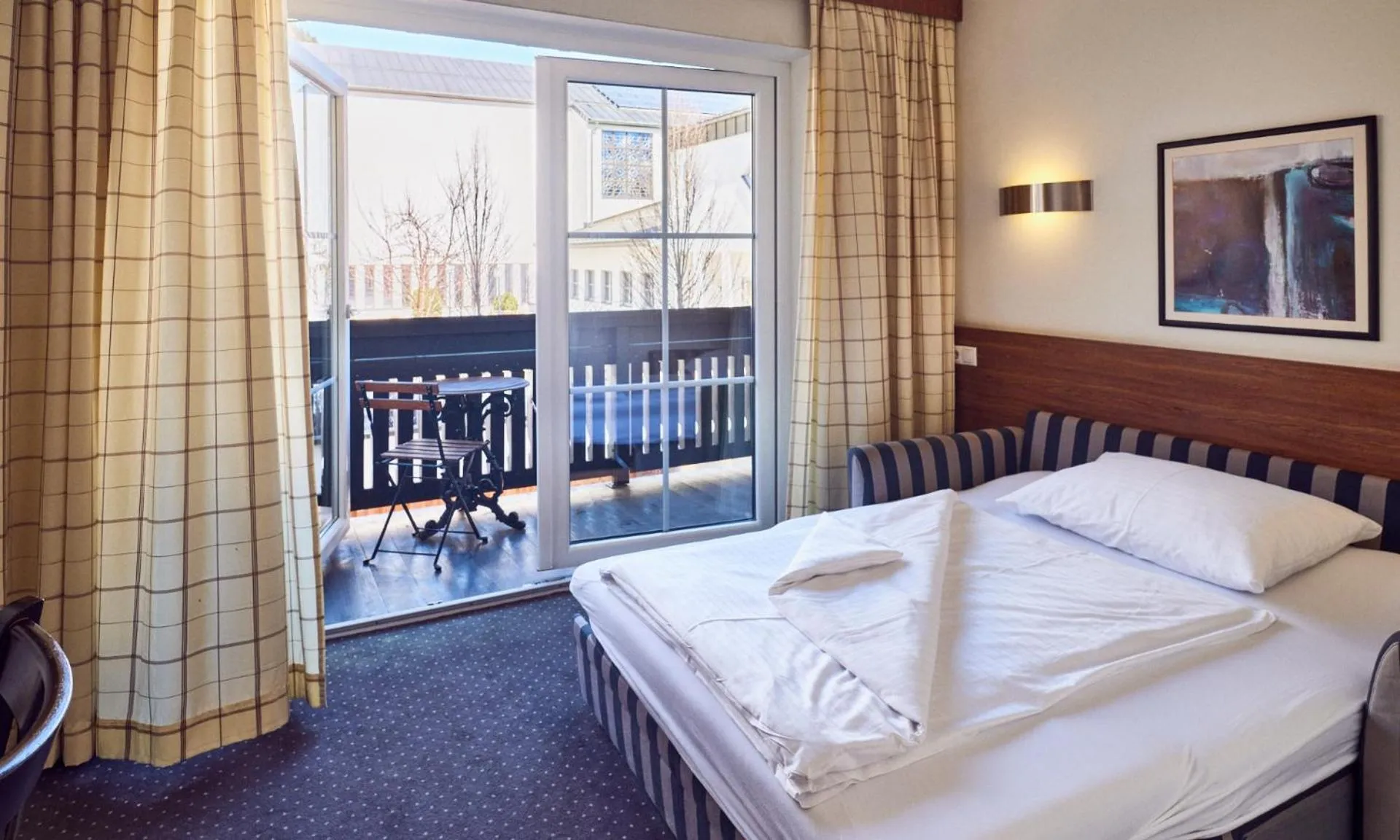 Bed in Hotel Pinzgauerhof by Alpeffect Hotels