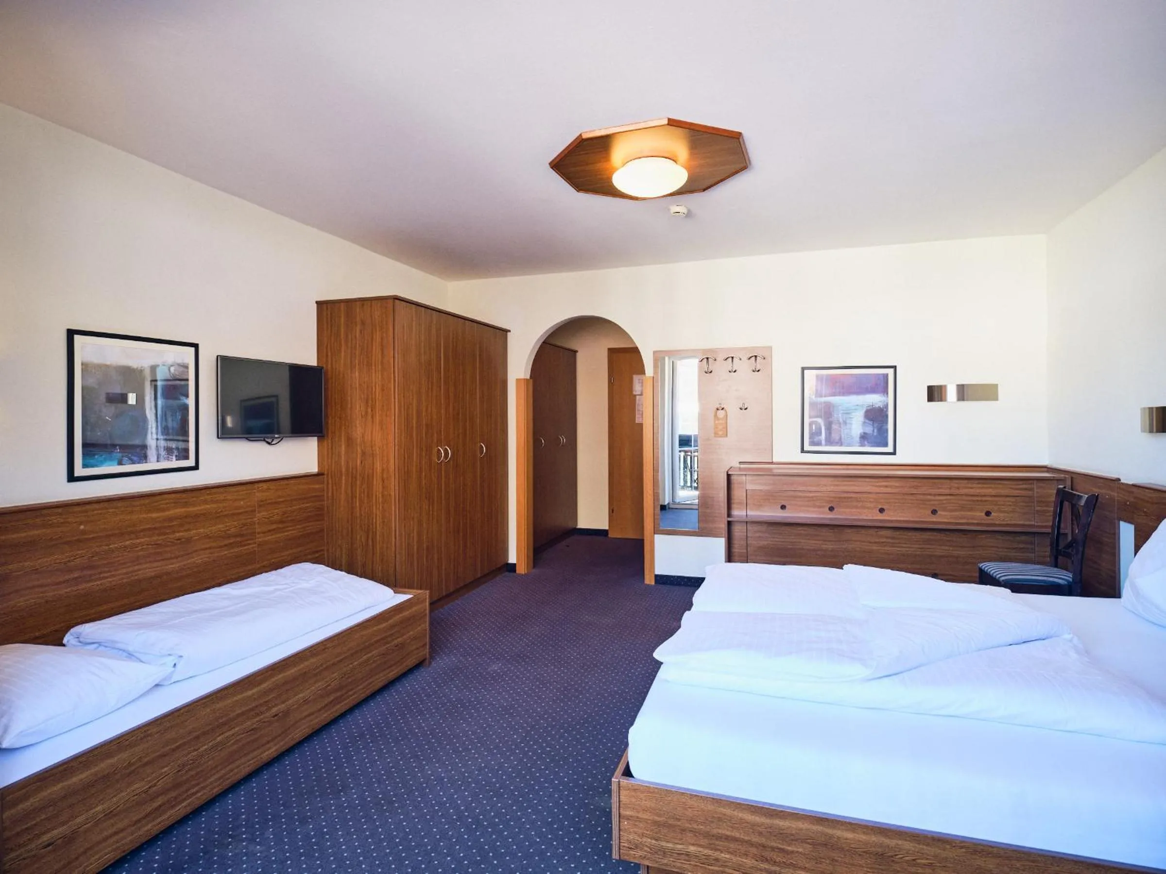 Photo of the whole room, Bed in Hotel Pinzgauerhof by Alpeffect Hotels