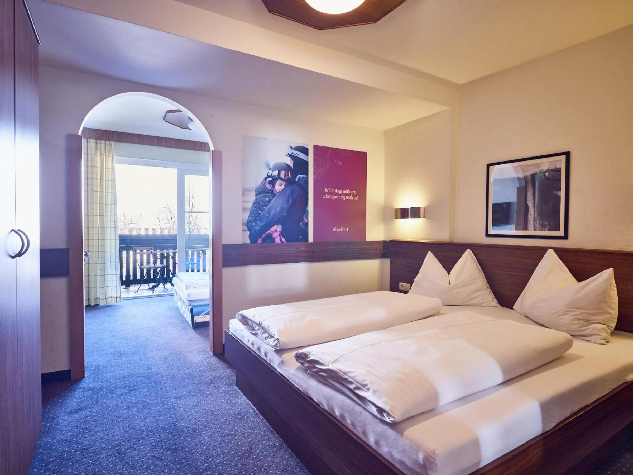 Bed in Hotel Pinzgauerhof by Alpeffect Hotels