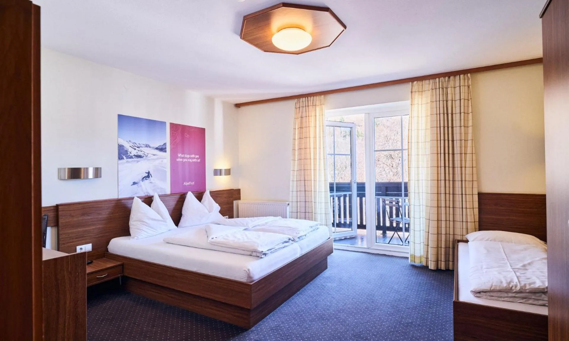 Bed in Hotel Pinzgauerhof by Alpeffect Hotels