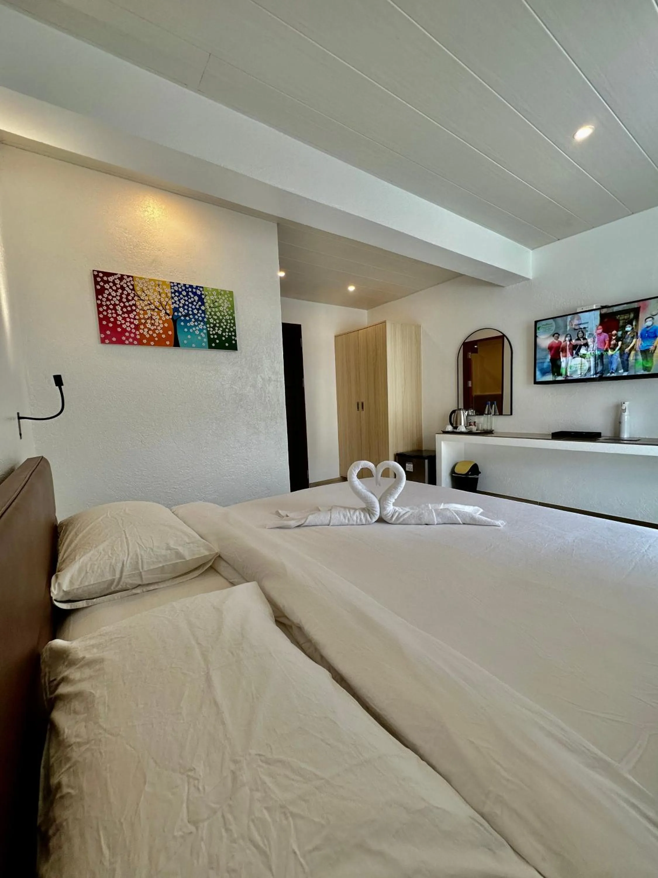 Photo of the whole room, Bed in Calypso Beach and Dive Resort