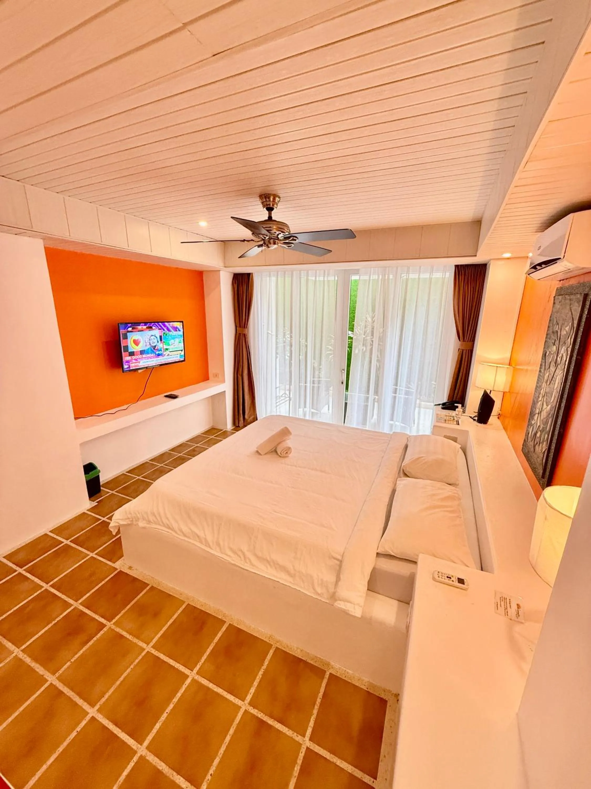 Photo of the whole room, Bed in Calypso Beach and Dive Resort
