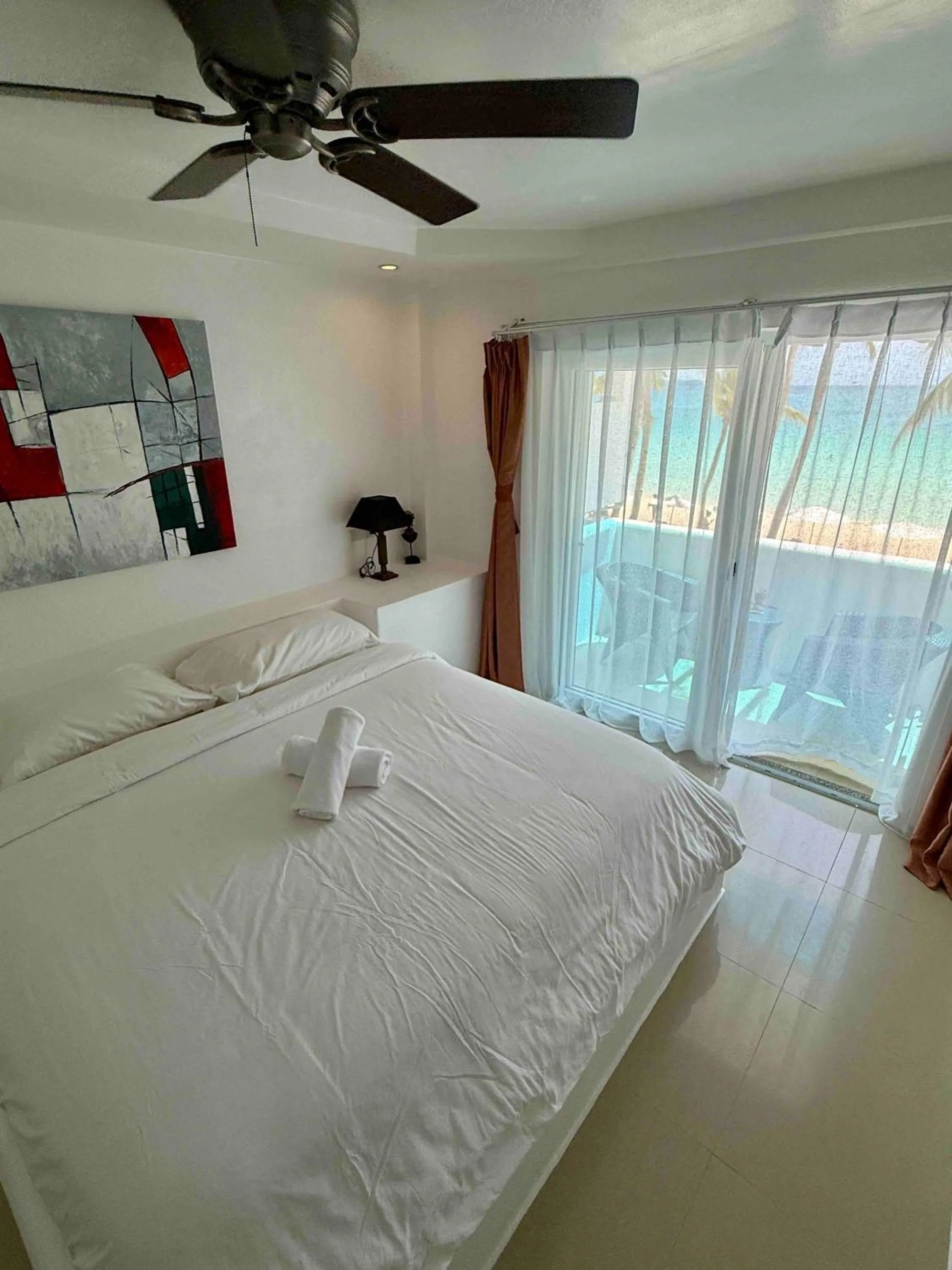 Bedroom, Bed in Calypso Beach and Dive Resort