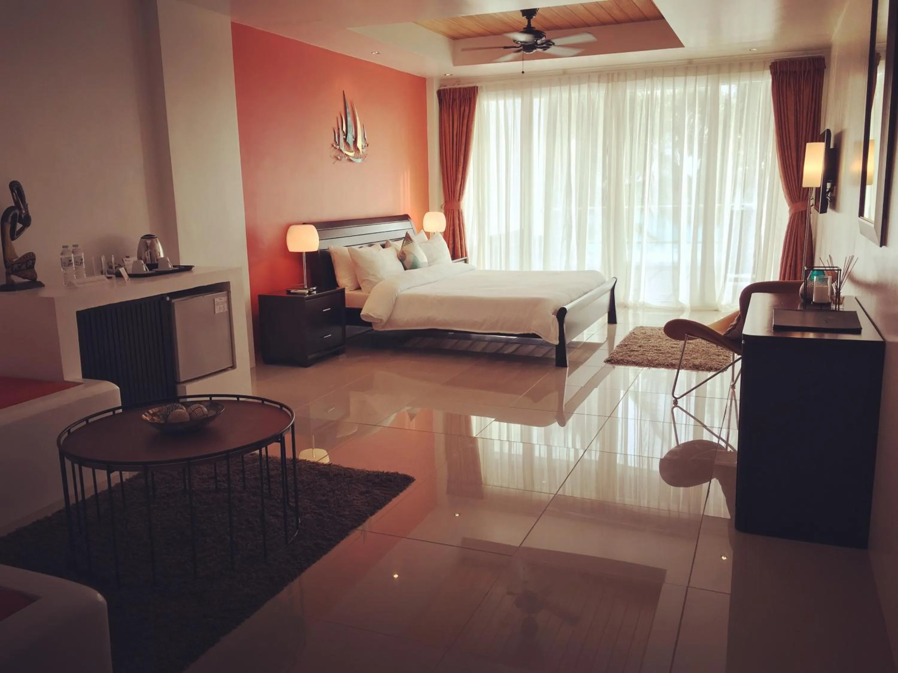 Photo of the whole room, Bed in Calypso Beach and Dive Resort