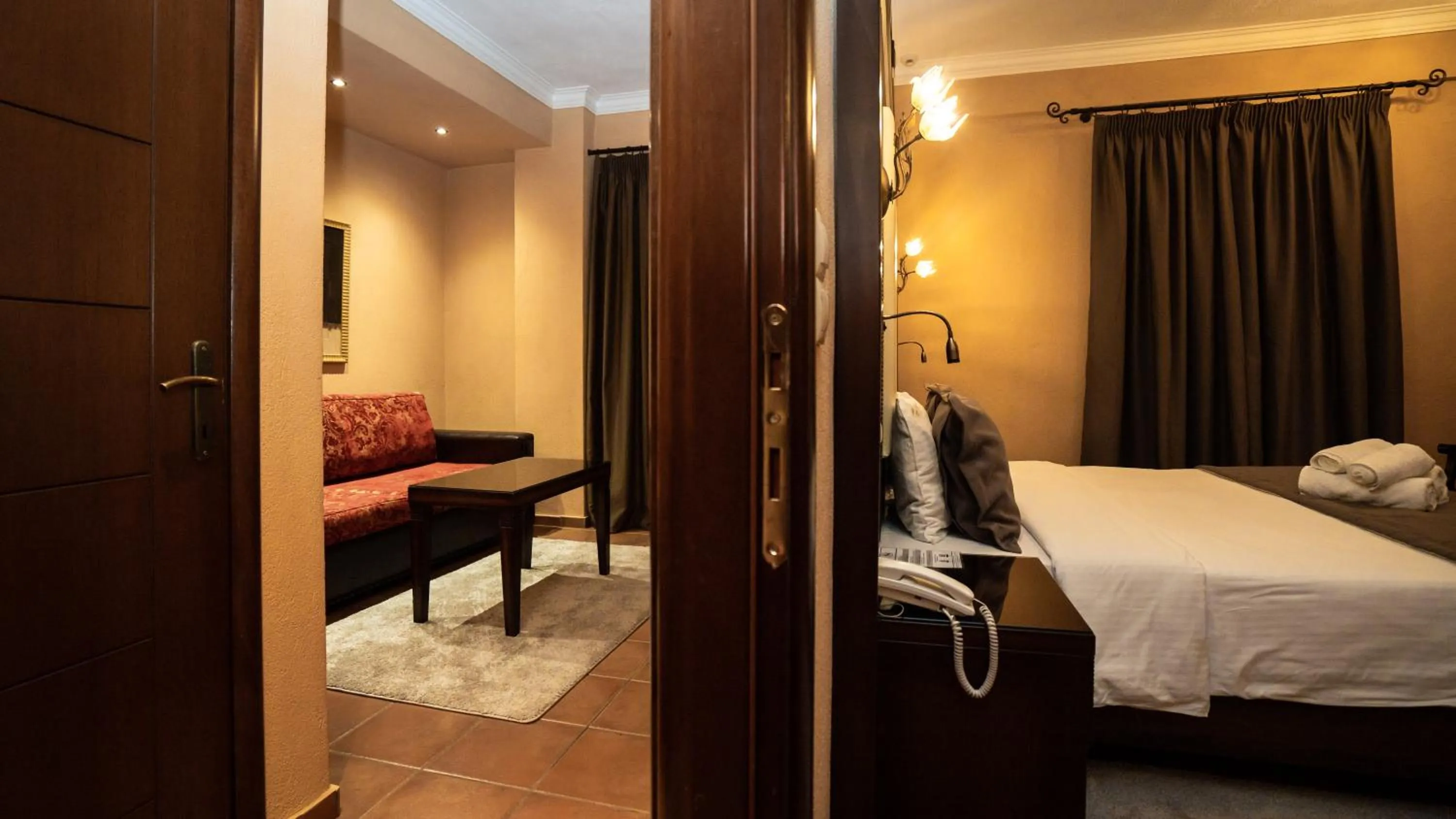 Photo of the whole room, Bed in Dellas Boutique Hotel