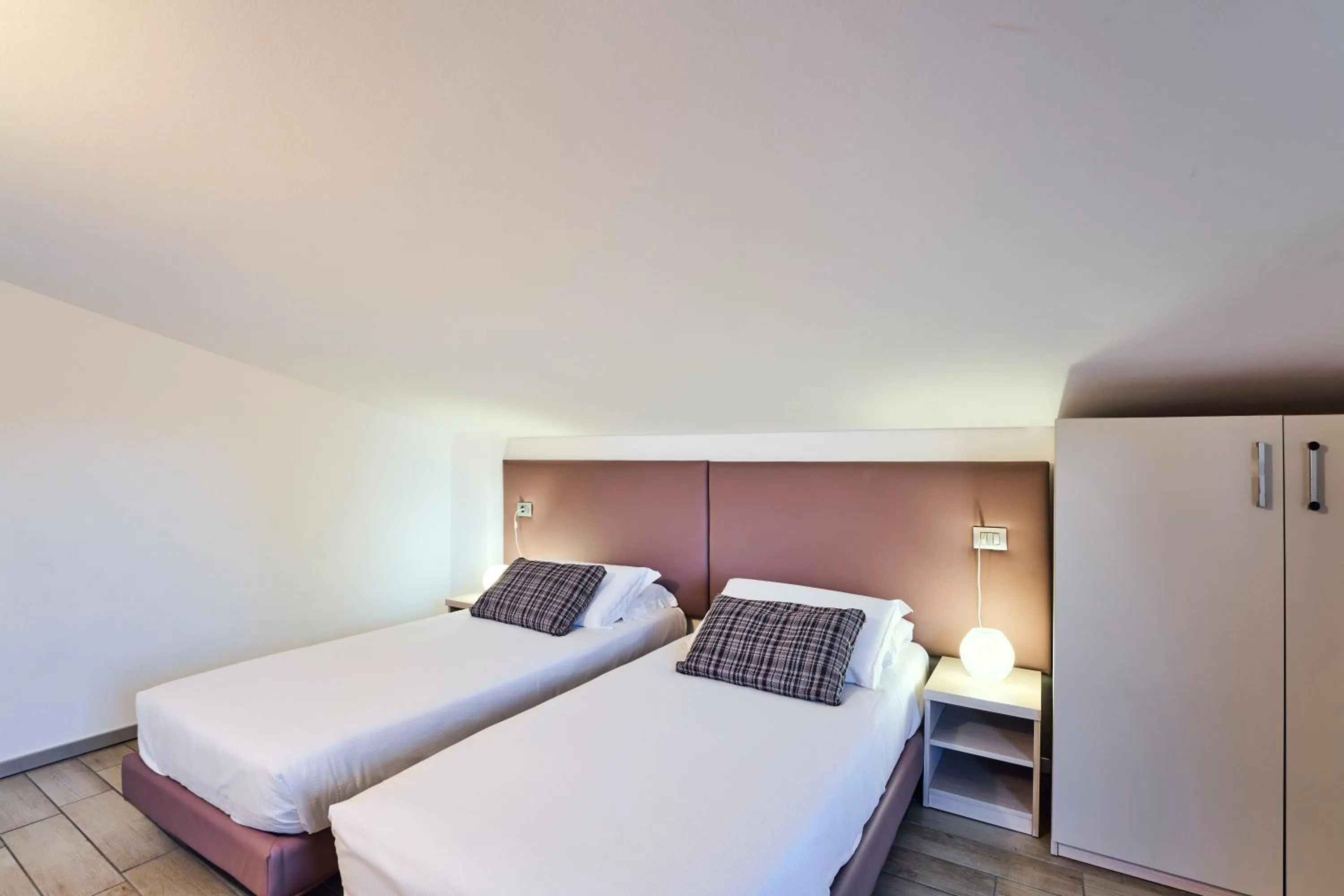 Bedroom, Bed in Bellagio Village - Holiday Apartments by the Lake - Seasonal Warm Pool and Sauna