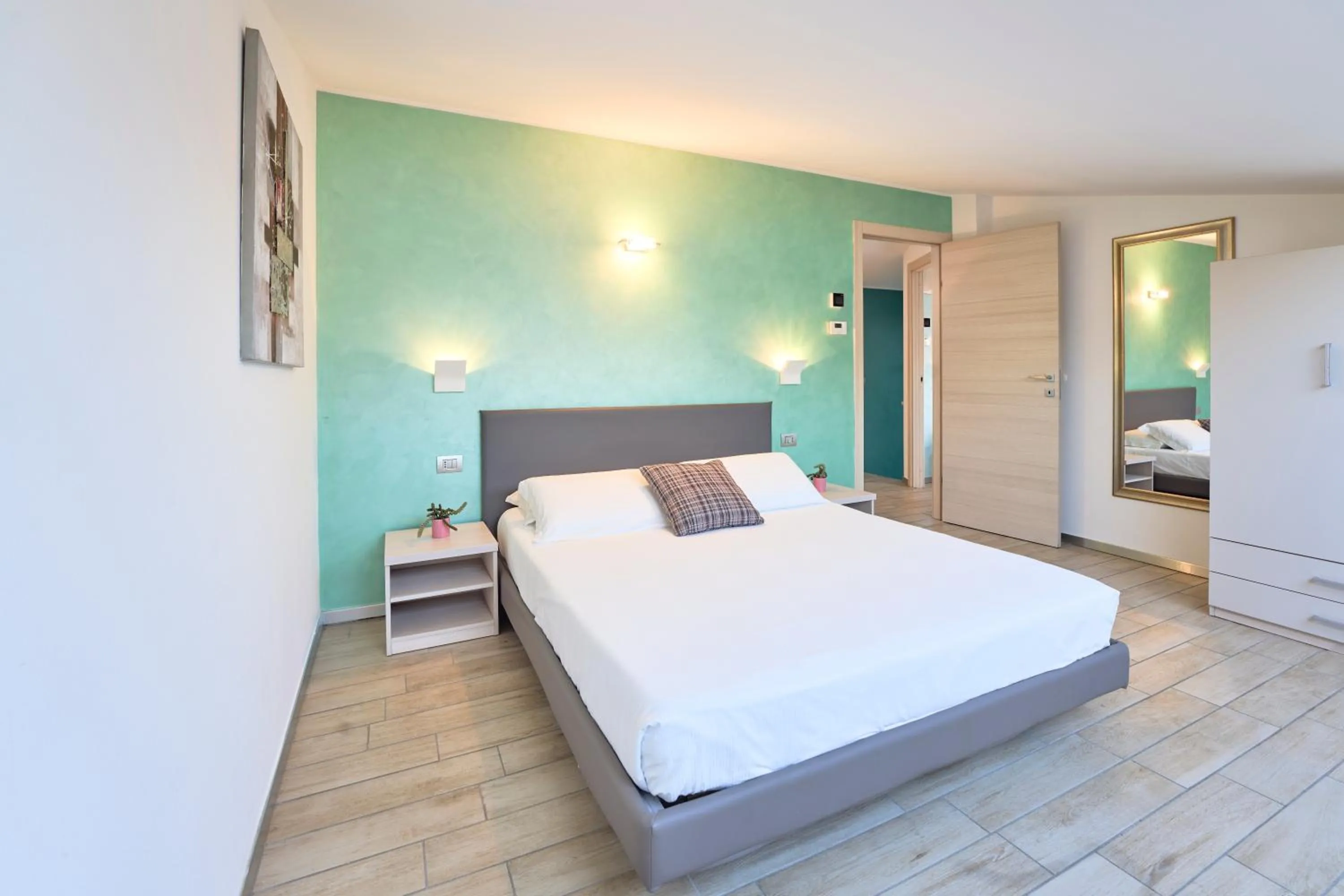 Bedroom, Bed in Bellagio Village - Holiday Apartments by the Lake - Seasonal Warm Pool and Sauna