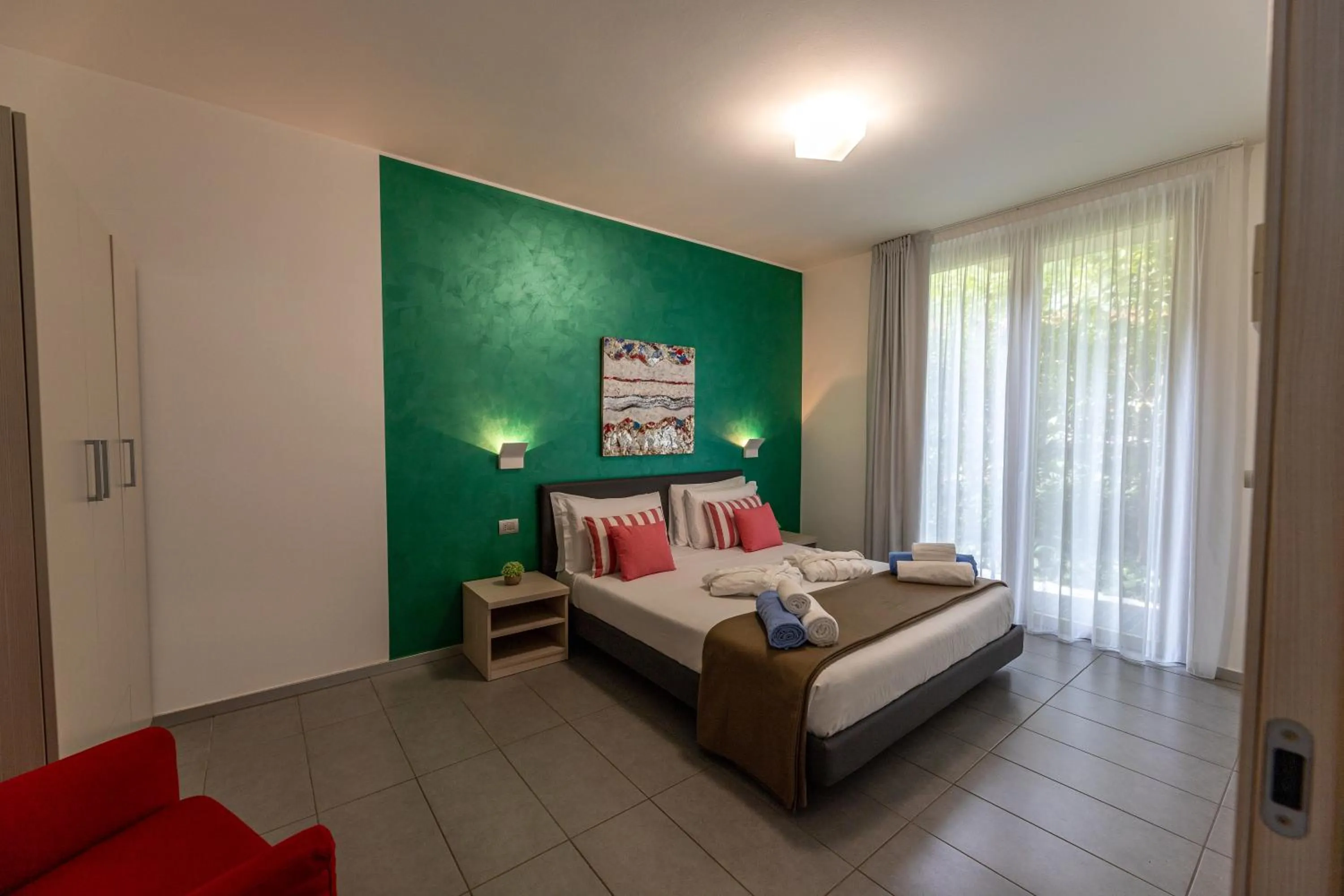 Bedroom, Bed in Bellagio Village - Holiday Apartments by the Lake - Seasonal Warm Pool and Sauna