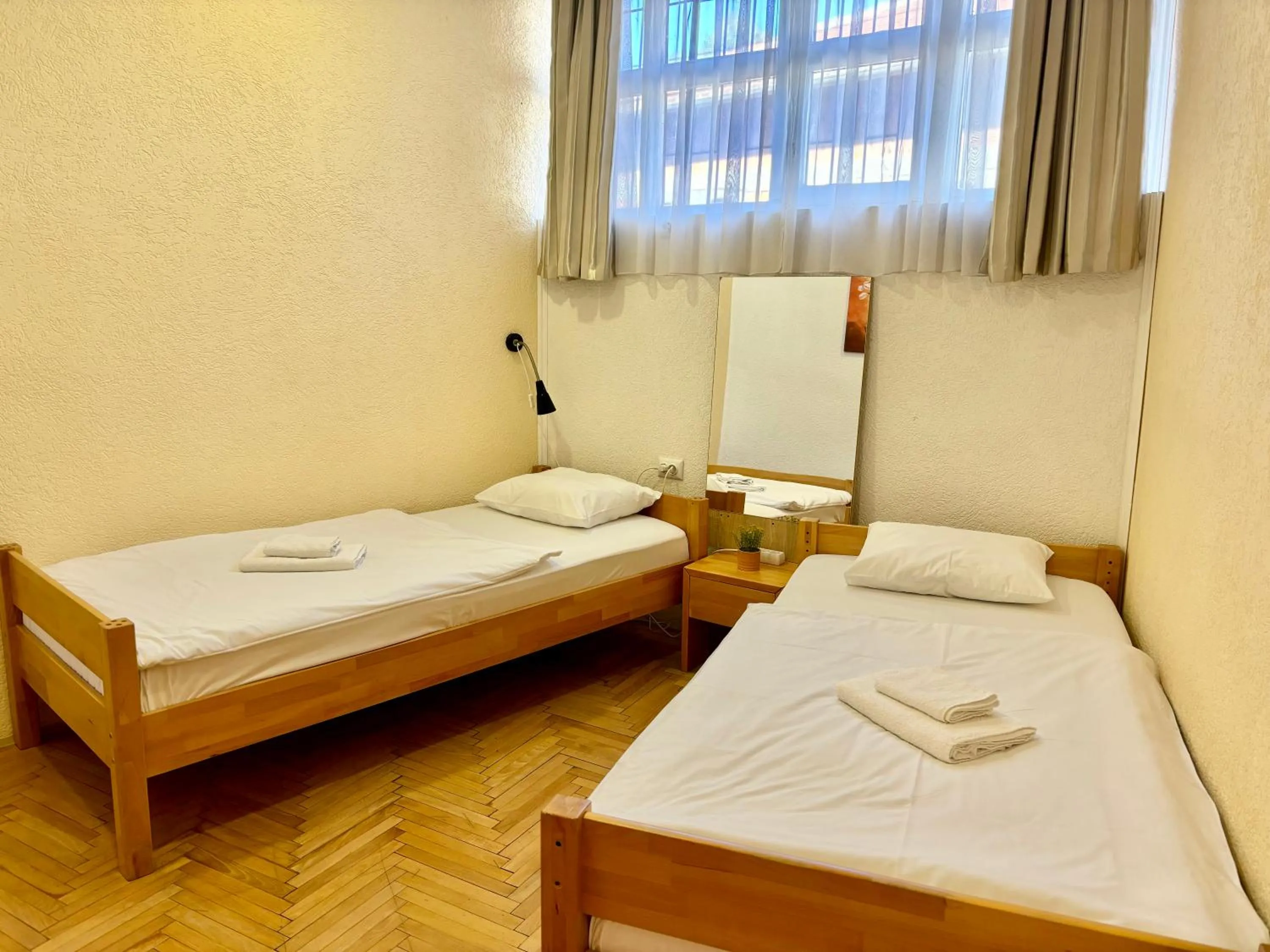 Bed in Pigeon Square Rooms