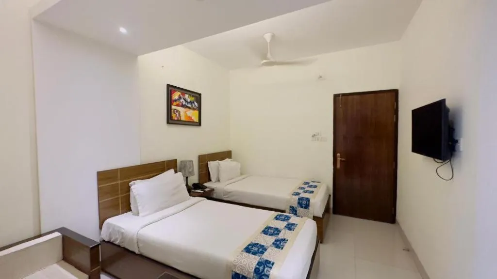 Bed in Royal Living Hotel & Suites