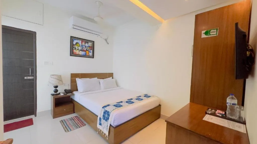 Bed in Royal Living Hotel & Suites