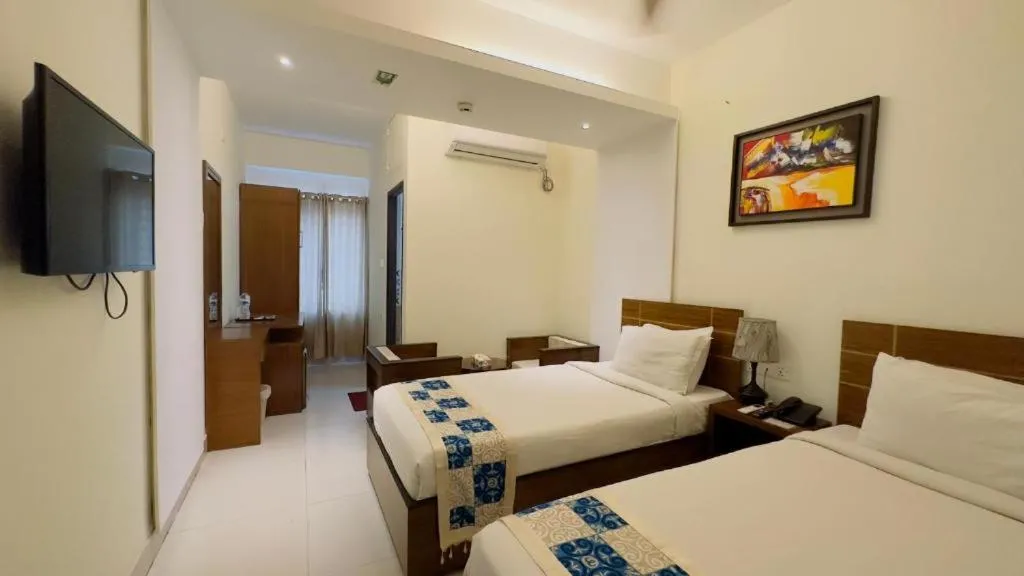Bed in Royal Living Hotel & Suites