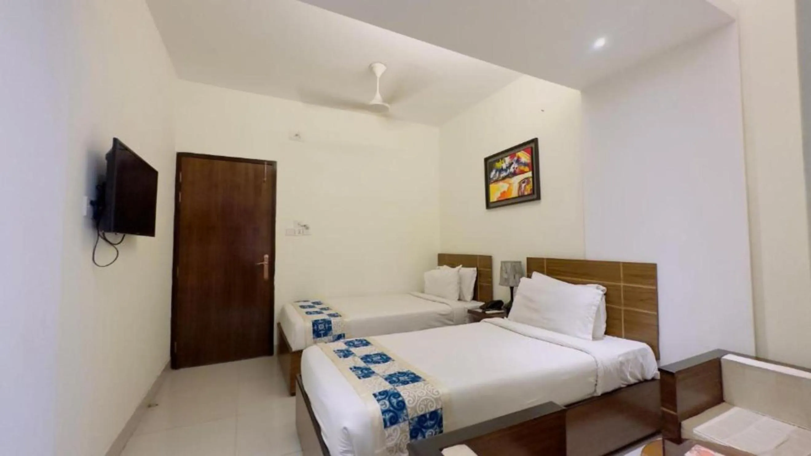 Bed in Royal Living Hotel & Suites
