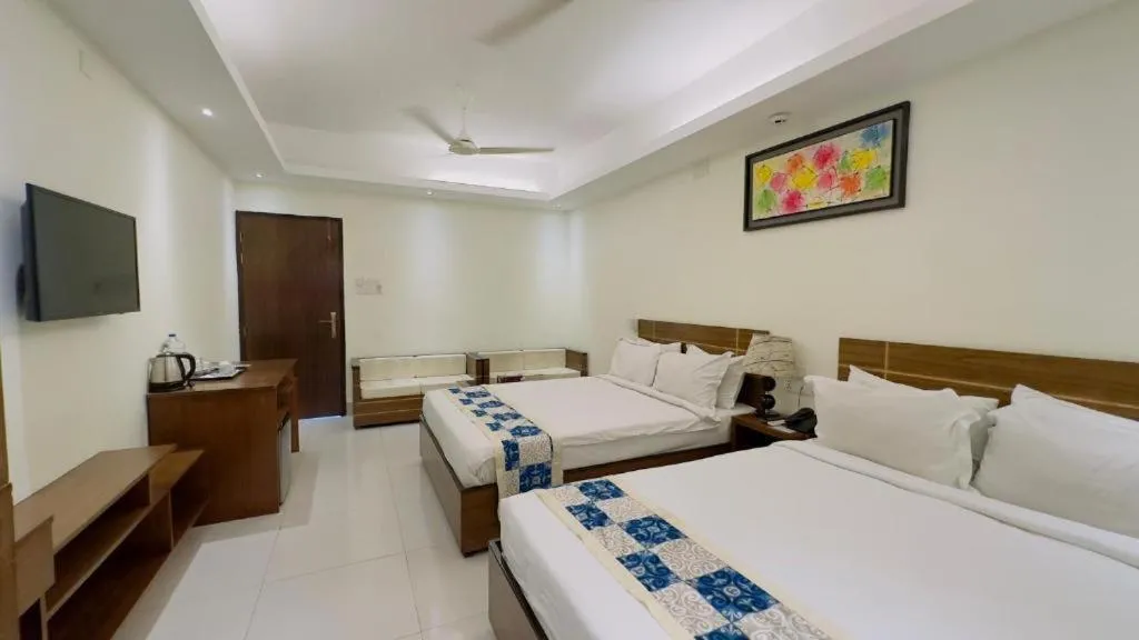 Bed in Royal Living Hotel & Suites