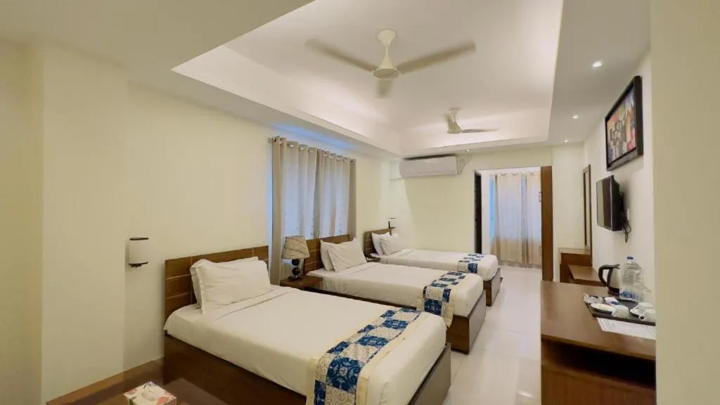 Bed in Royal Living Hotel & Suites